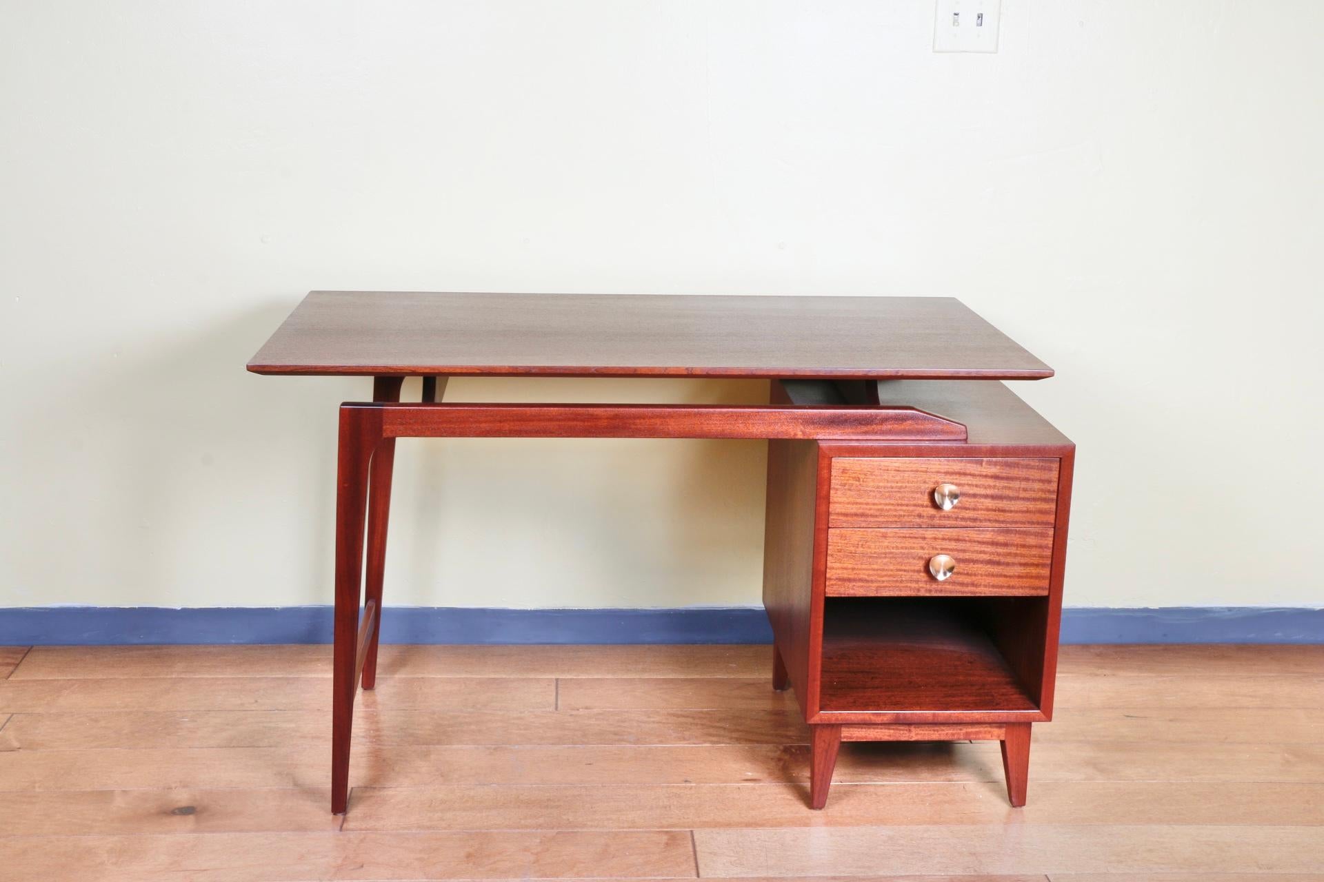 Vintage Mid-Century Modern floating brown walnut desk and chair. Very well kept and has been refinished. Great design and style with working drawers. Nice detailed desk design. Chair is very well and sturdy.