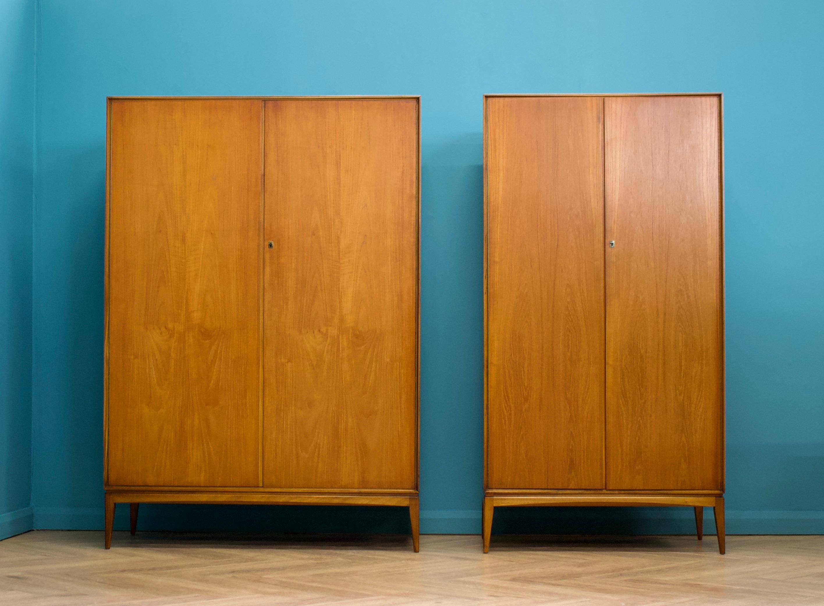 A freestanding double door teak wardrobe from McIntosh - in the Danish modern style Made during the 1960s Fitted out with two clothes rail and fixed shelving for ample storage
The style of this wardrobe is minimalist - with it's clean lines,