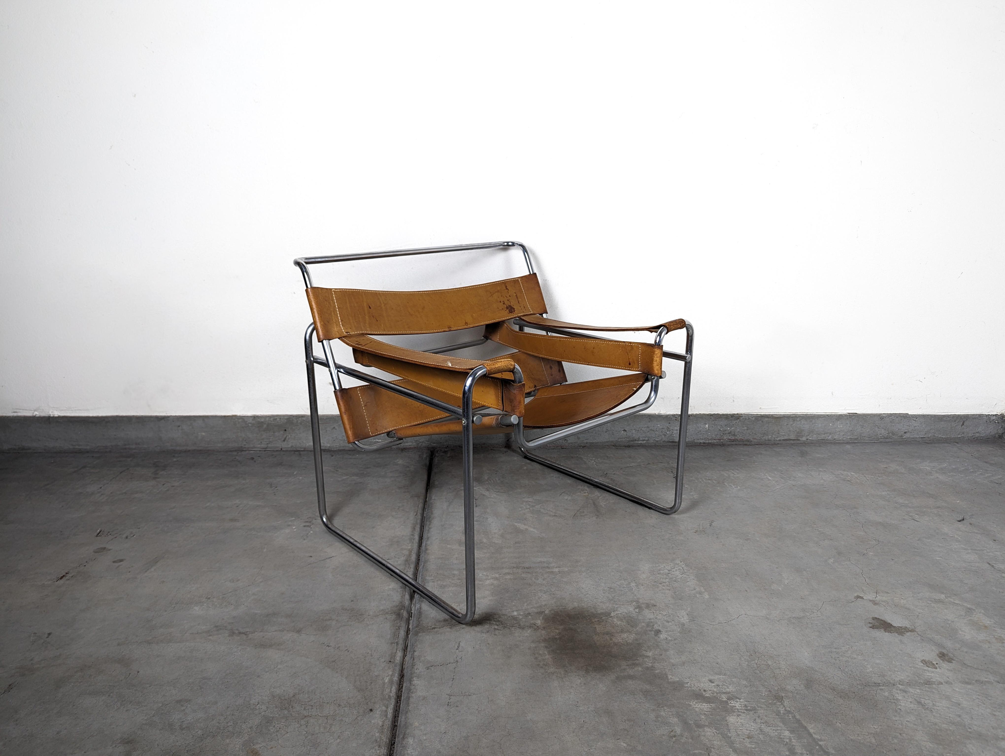 For sale is a genuine mid-century Wassily Chair, a remarkable piece from the iconic designer Marcel Breuer. This chair is a testament to the enduring appeal of mid-century design, showcasing the clean lines and innovative materials that characterize