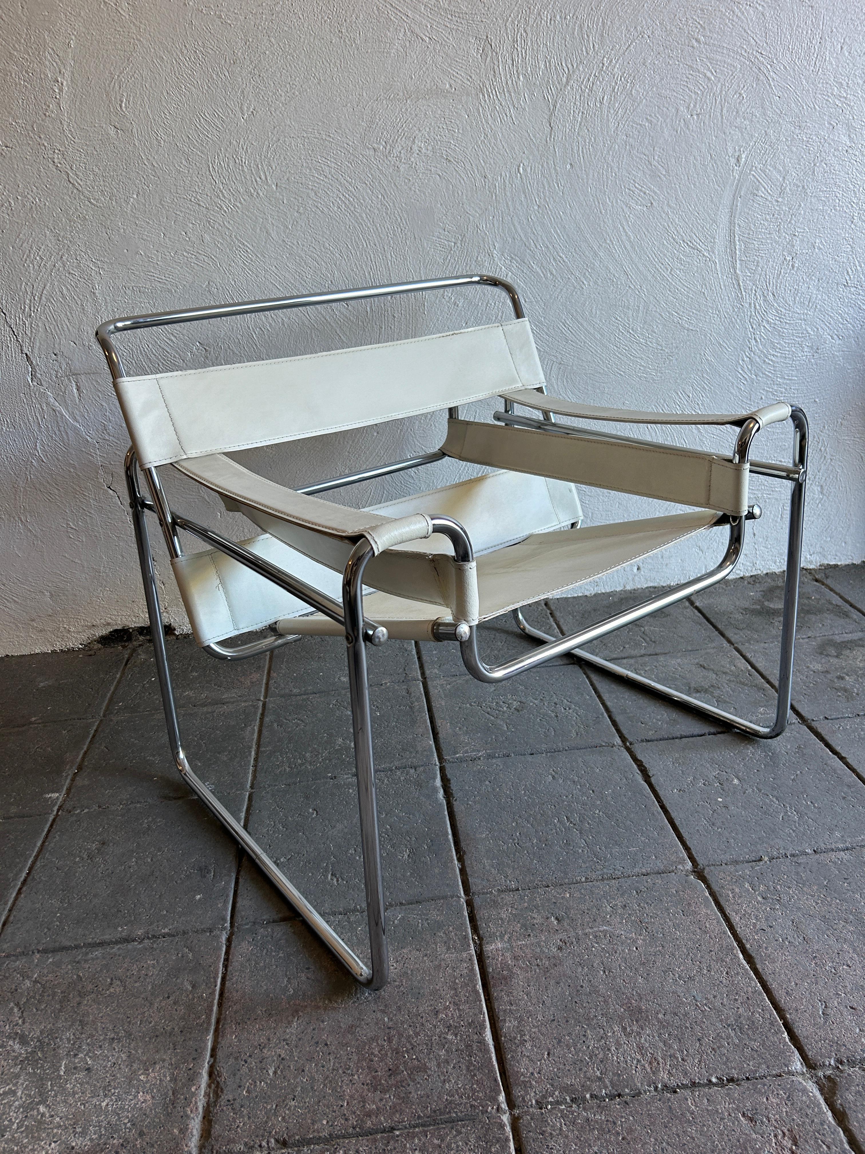 Vintage mid century post modern Wassily lounge chair in the style of knoll and designs by Marcel Breuer in white full leather. This vintage chair circa 1980s chrome is good and white leather is thick and tight with good stitching. Good example high