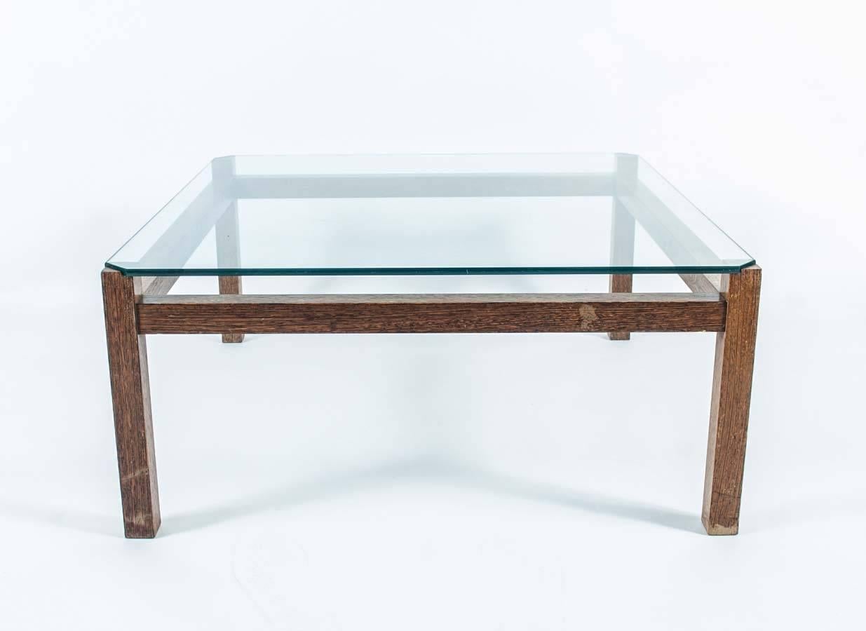 This coffee table made of wenge wood with a glass top was designed by Kho Liang Ie, a Dutch-Indonesian talent best known for his design of the Schiphol Amsterdam Airport branding.
His work can be found in prestigious museums such as the Stedelijk