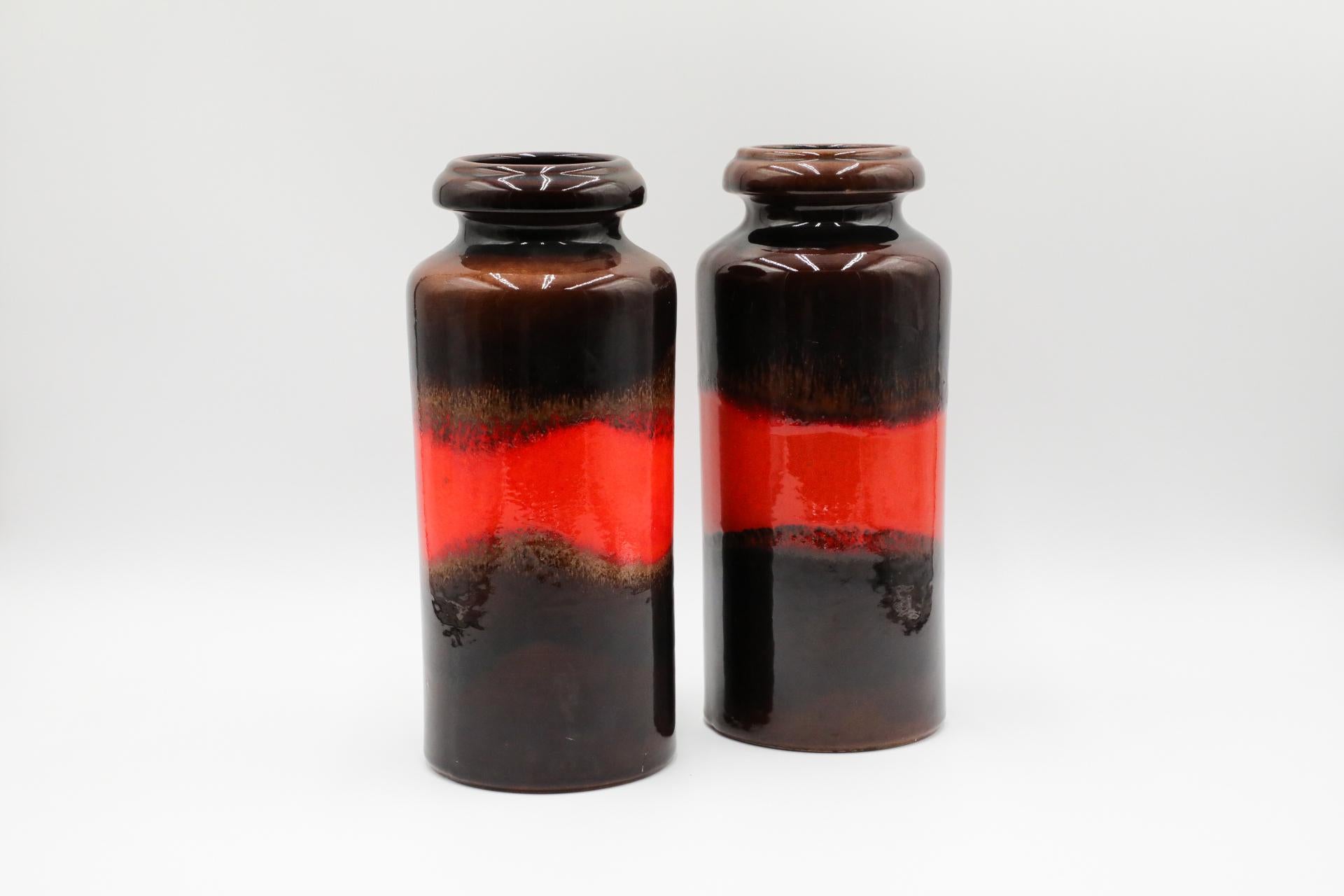West German dark brown ceramic vase with orange stripe. Marked 517-30 on bottom. In original condition with visible wear consistent with its age and use. Two available.