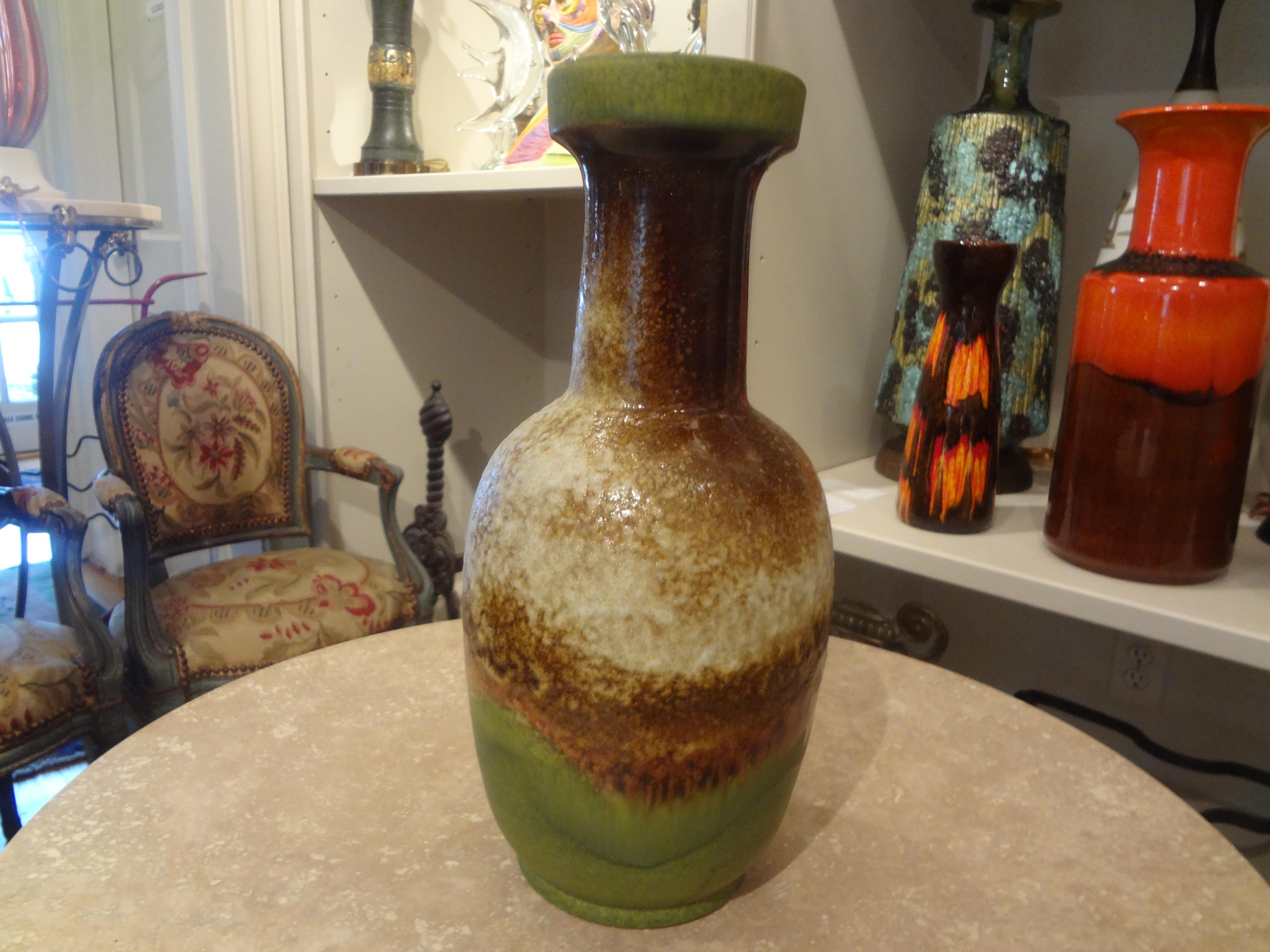 Mid-Century West German pottery vase by Dumler & Breiden. This West German Vase has beautiful colors and glaze. We have a large collection of West German pottery vases listed on 1stdibs. Check them out at Kirby Antiques, Houston.