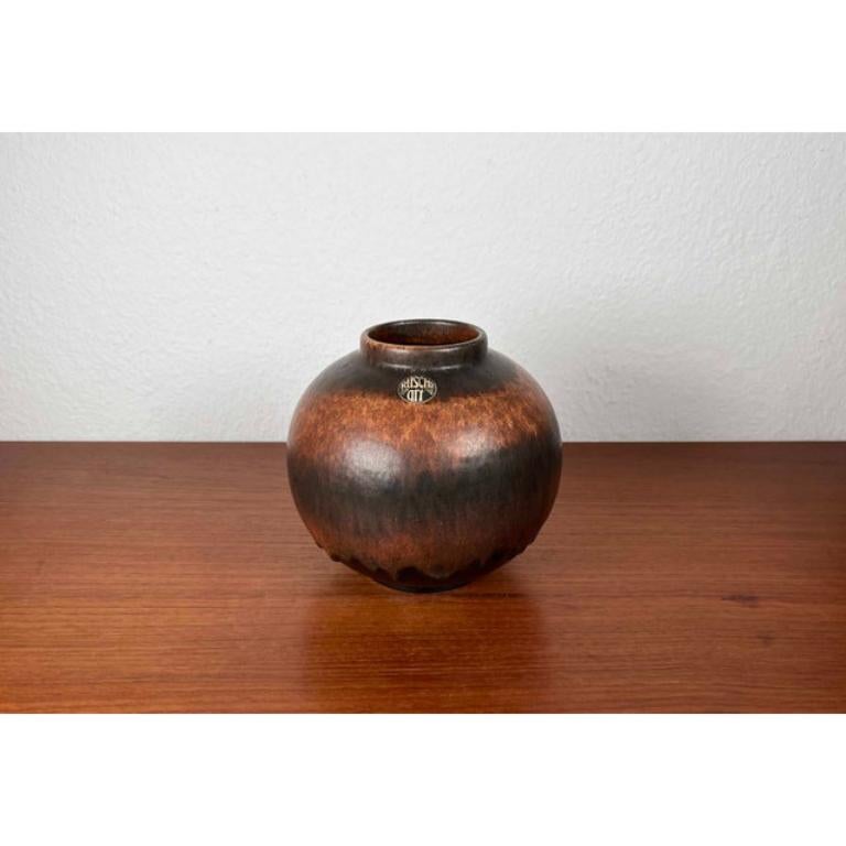 Mid-Century West German Pottery WGP Fat Lava Vase from Ruscha, 1960s, in Very Good conditions. Designed 1960 to 1969 This piece has an attribution mark,
Official proof of authenticity such as vintage catalogs, designer records or other literature