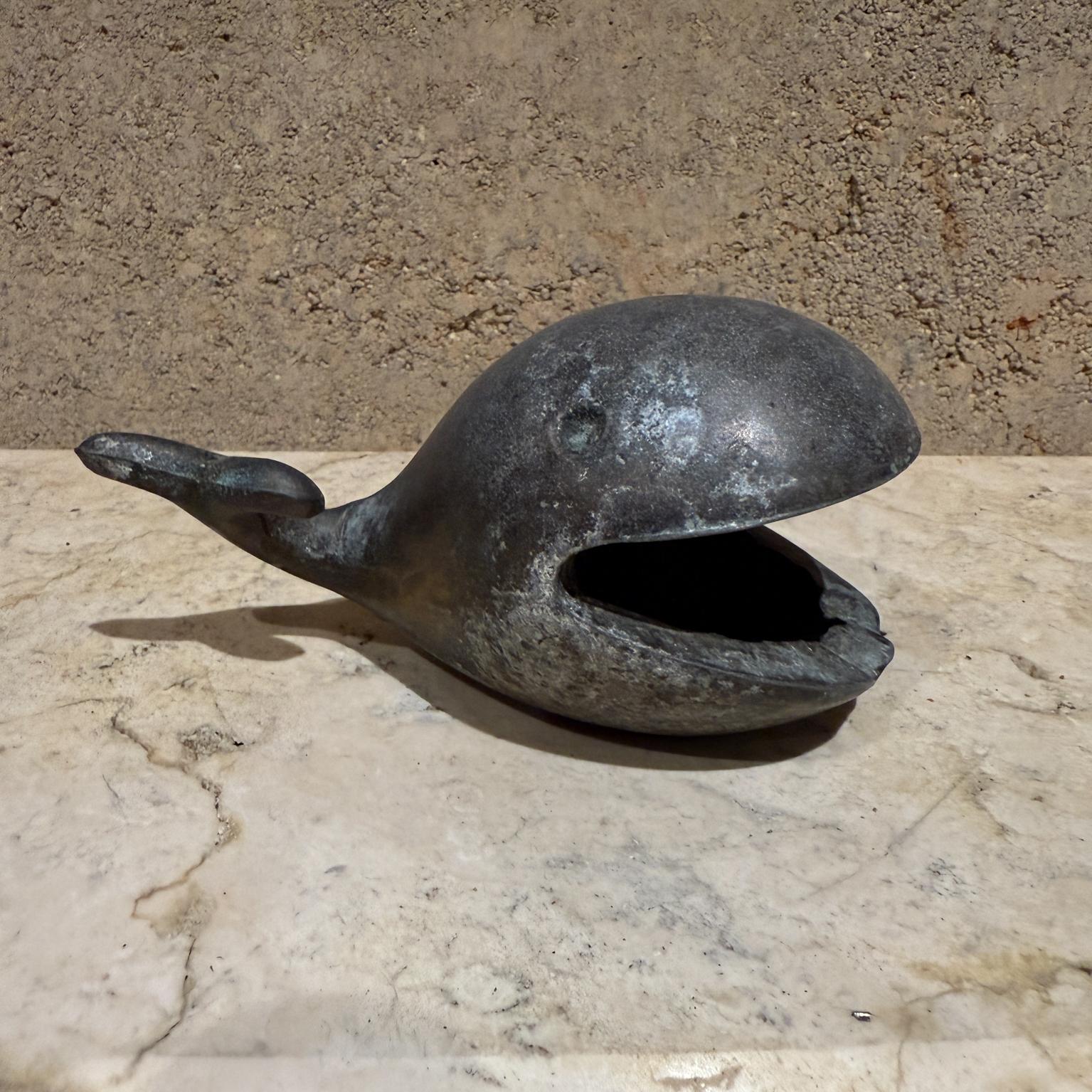 For your consideration a vintage whale ashtray in the style of Walter Bosse - Carl Aubock.
Designed by Robert Emig
Constructed with metal. Nice character patina. 
Dimensions: 5 W x 3 D x 4 H

Please visit take a look at our listings, we have an