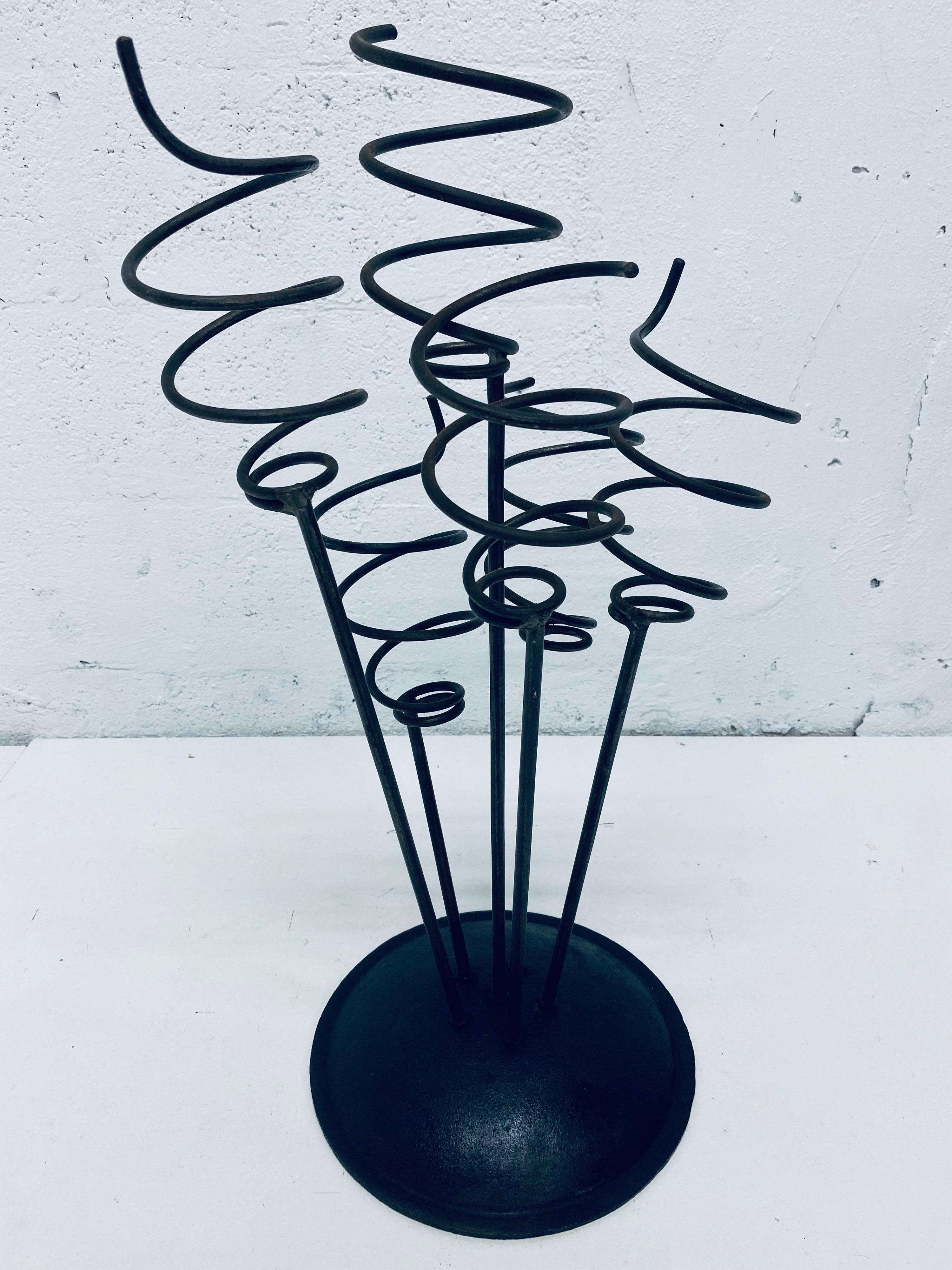 Whimsical black lacquered iron umbrella stand or wine rack from the 1960s.