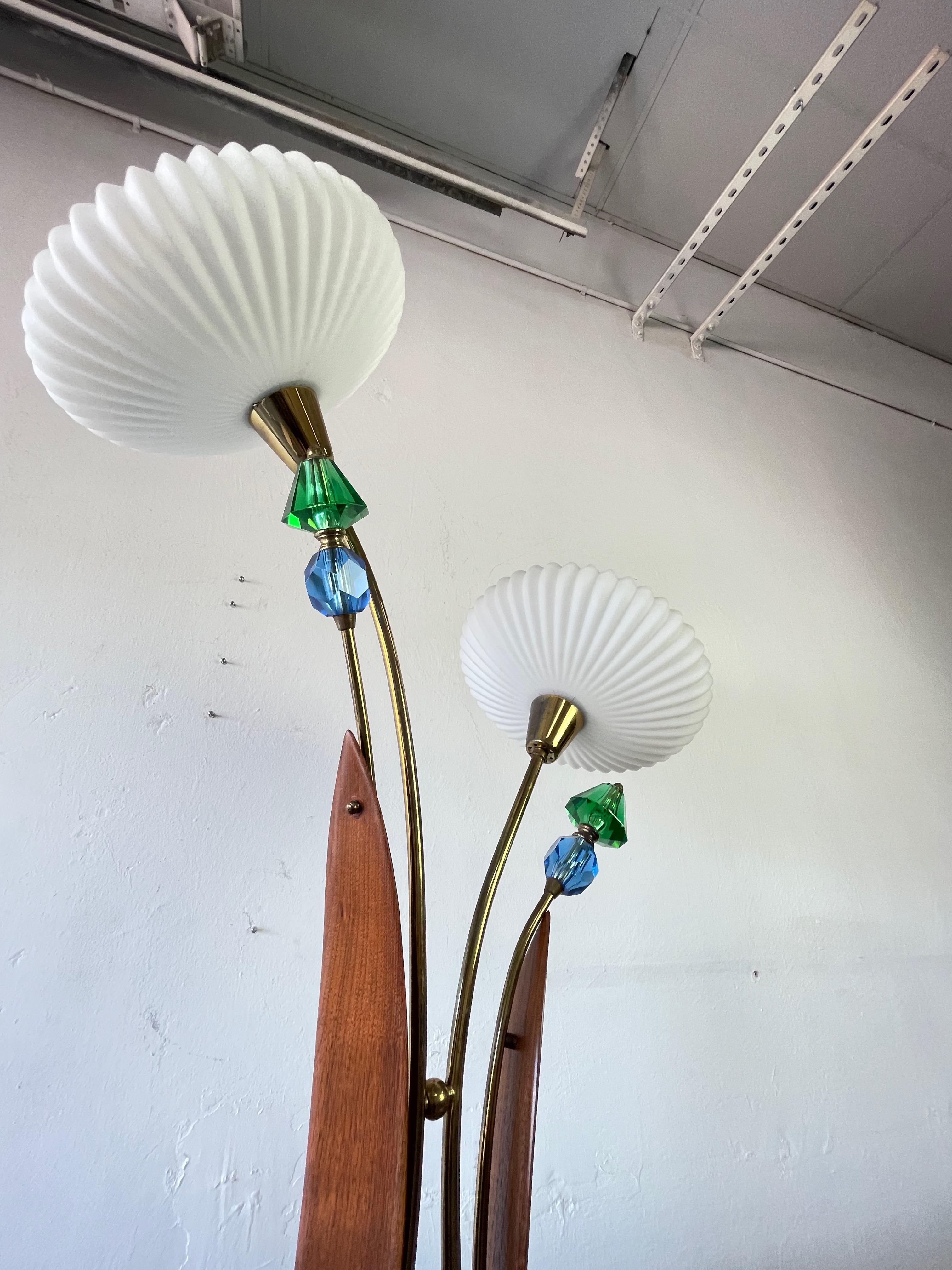 Very unique Luxcraft mid century whimsical & sculptural table lamp. 

With a very cool Eames style saucer milk glass shades. You might see a similar lamp but you are not going find this exact one, that is for sure. Brass has a wonderful