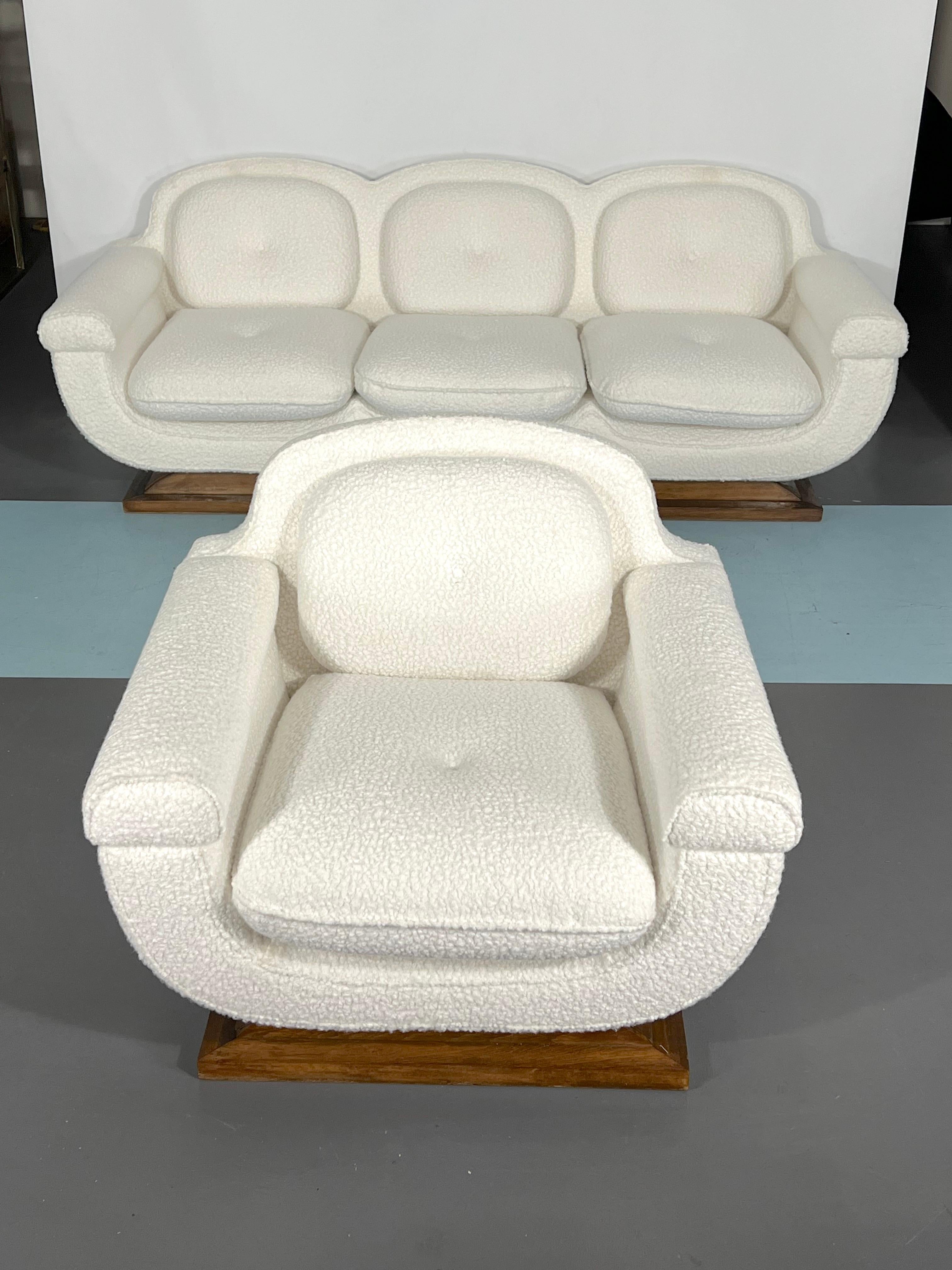 Great condition for this Art Deco set of a sofa and an armchairs with wood base. Reupholstered with white bouclé fabric. Italy 1930s.