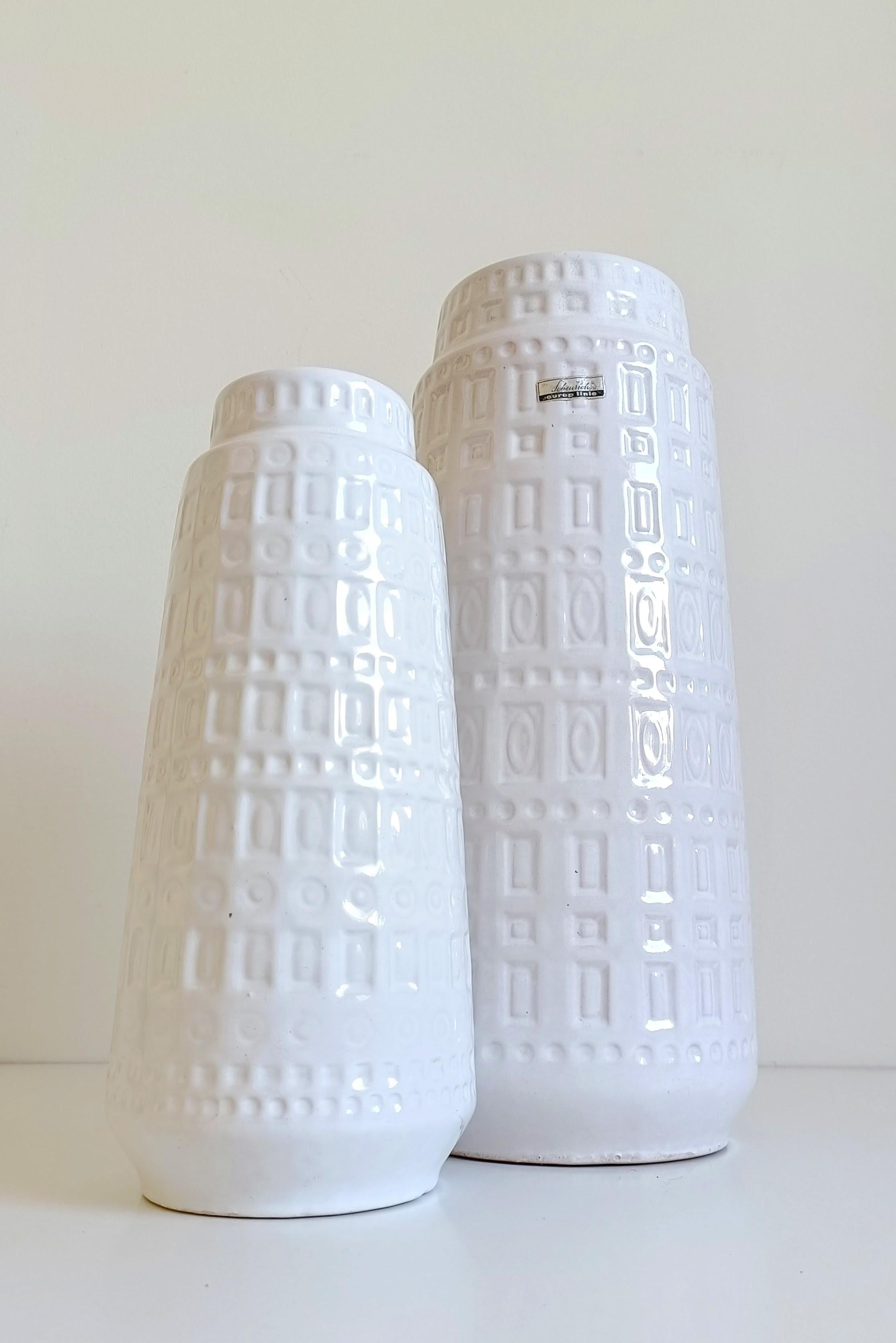 Pair of Mid-Century Modernist White Glazed Ceramic Vases by Scheurich, West Germany – “Inka” Decor

A stunning pair of mid-century modern ceramic vases by renowned West German manufacturer Scheurich, showcasing the iconic “Inka” decor. Featuring a