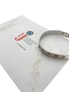 Pulsera de oro blanco de mediados de siglo con rubíes