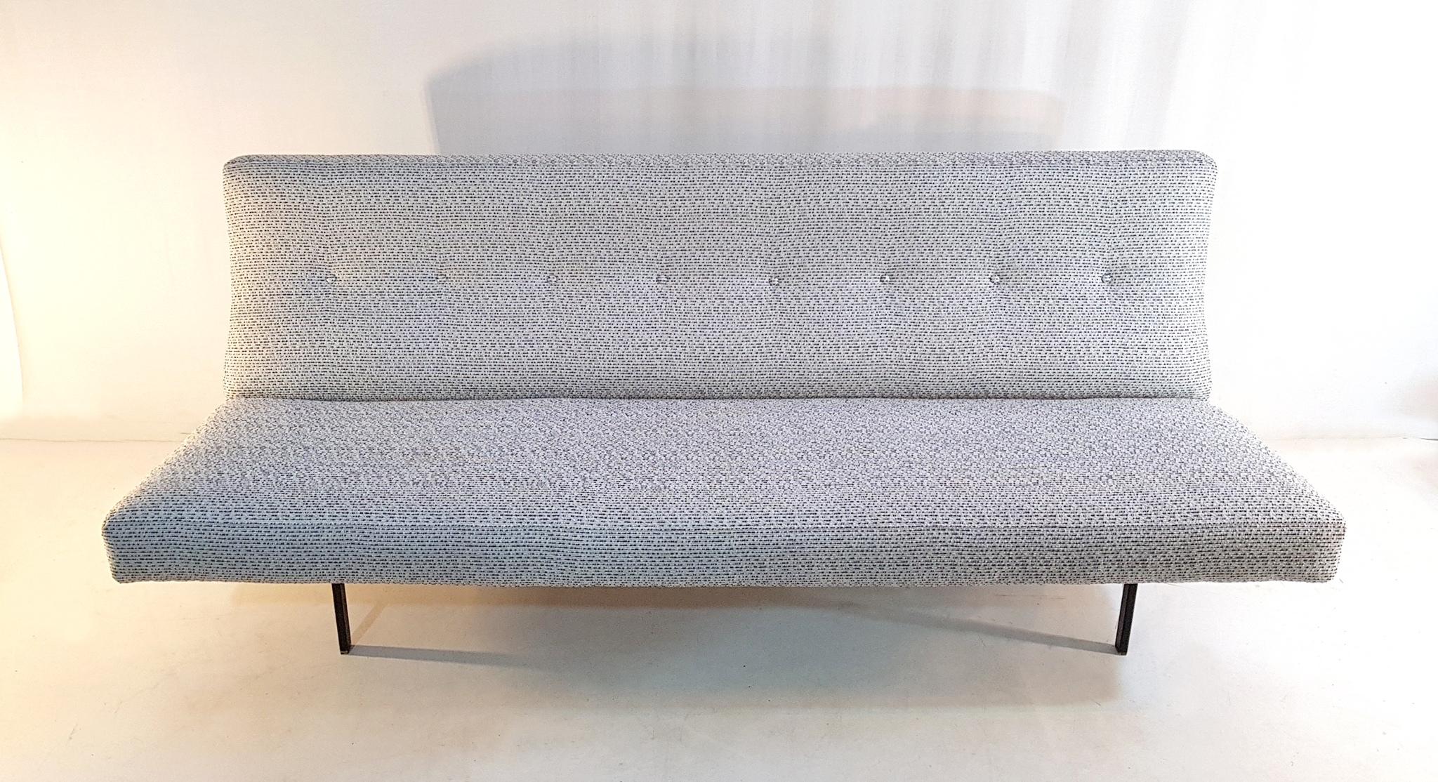 This Italian 1950s sofa has recently been professionally reupholstered in a strong quality fabric in black and white so called 