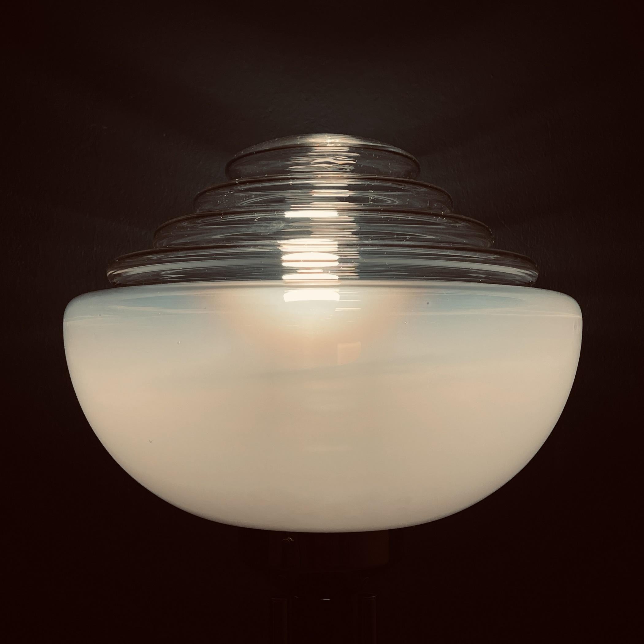 Mid-century milky white Murano glass floor lamp by Mazzega, made in Italy in the 1970s. The lamp is of a very unusual and rare shape. This perfectly conveys the spirit of the space age, the mid-century style. Excellent vintage condition, no chips or