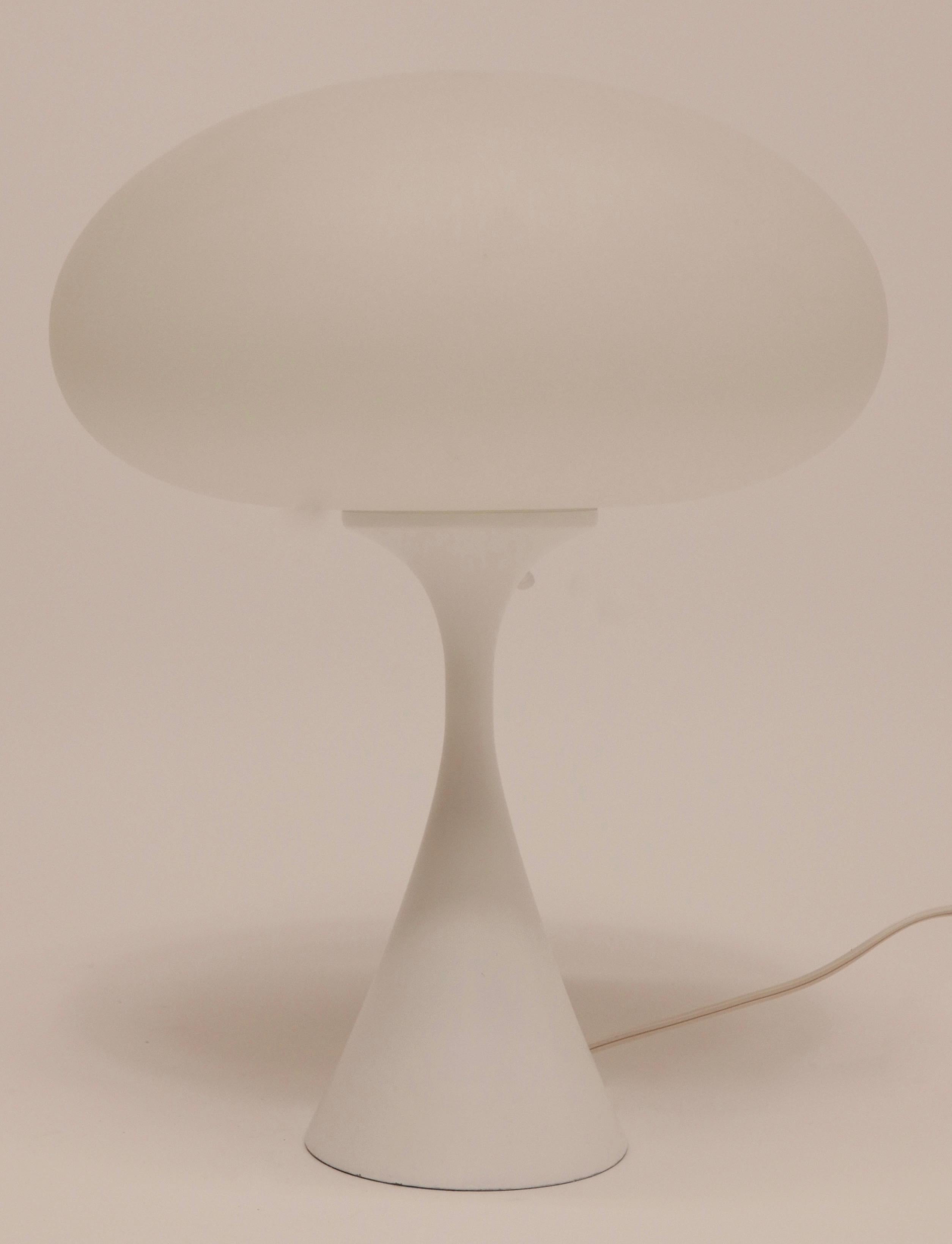 A Laurel Lamp Company white frosted mushroom globe on a white metal base table lamp.
The Laurel Lamp Company of Newark, NJ, was an active tastemaker in Mid-Century Modern lighting from the 1950s-1970s.
Professionally rewired and restored.