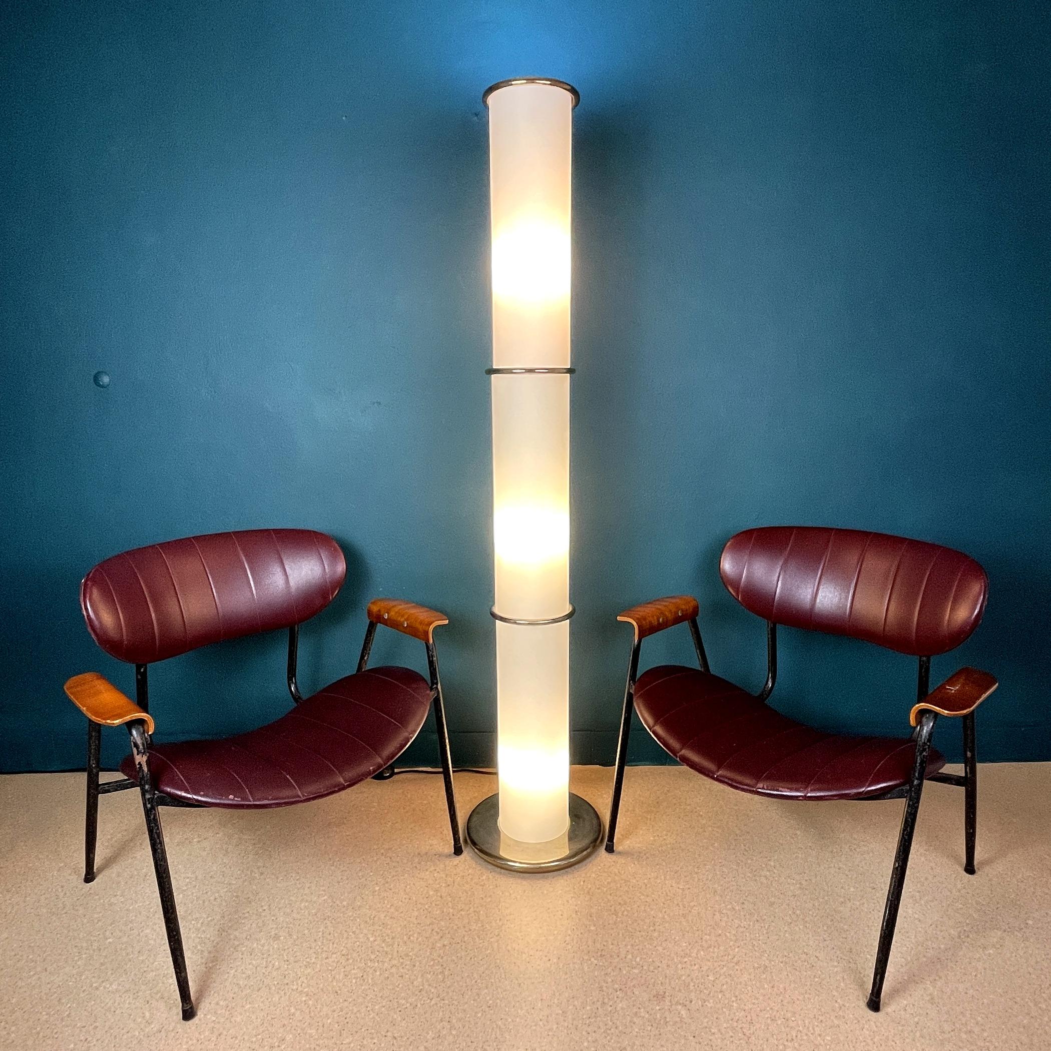 Mid-century white opaline glass floor lamp made in Italy in the 1970s. This gorgeous vintage floor lamp is made up of three cones. Lighting works in three modes: top light only, bottom three bulbs, all four bulbs together. Milky glass creates a