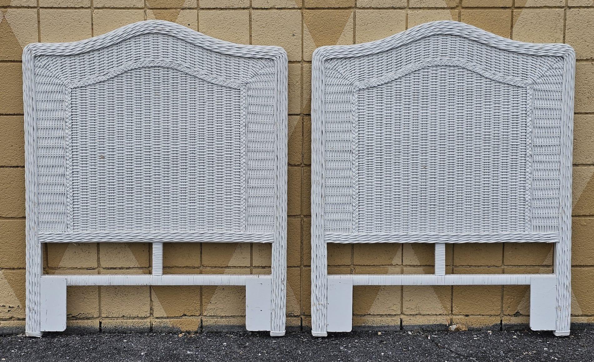 A pair of Mid Century White Painted Woven Wicker and Rattan Twin size Headboards. Measure 40