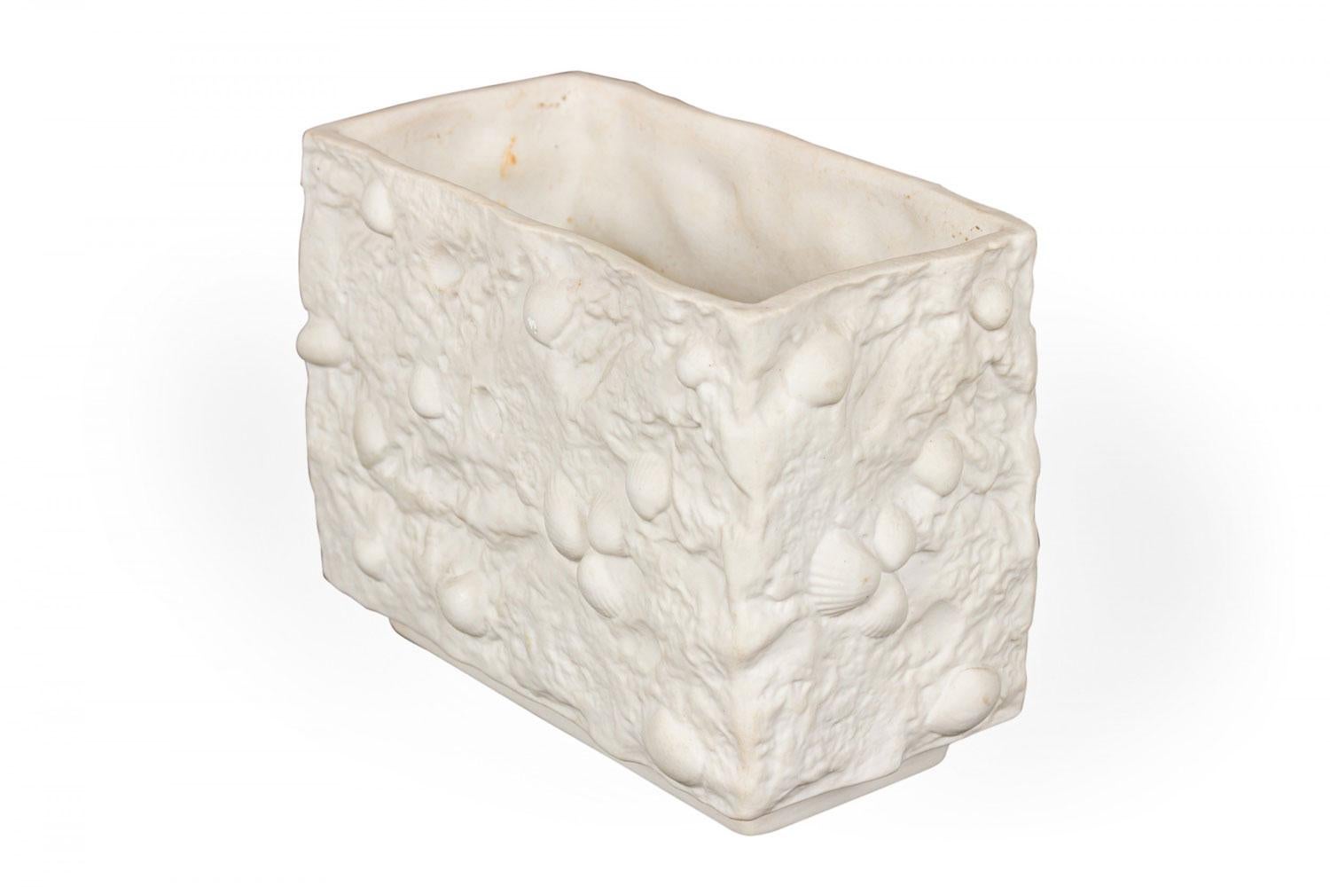 German Mid-Century rectangular porcelain vase with embedded seashells and a textured exterior. (Similar piece: 063059)