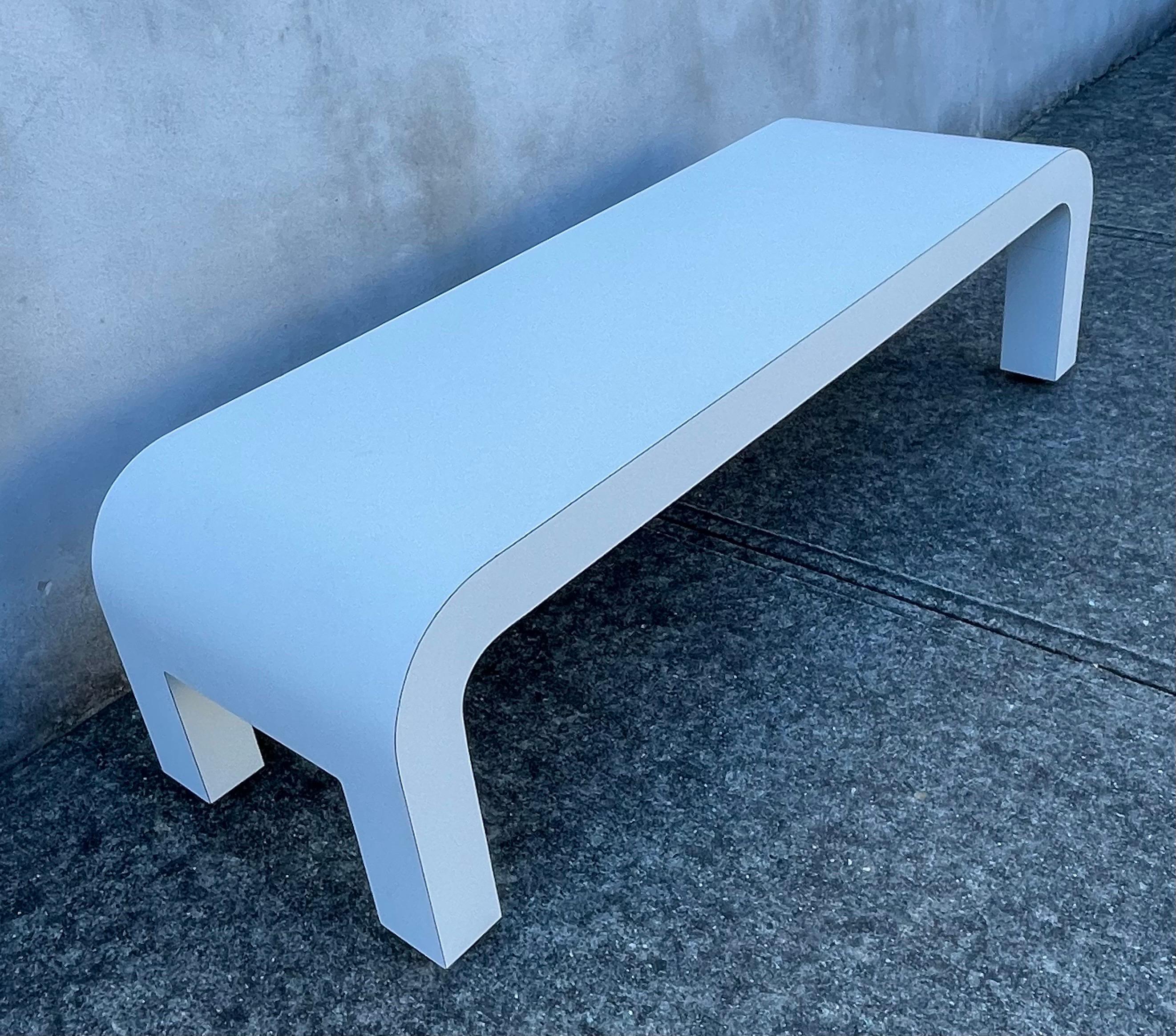 Very cool mid century white rectangular coffee table very much in the style and design by Karl Springer. This piece is most likely a custom piece and one of a kind, white formica, acquired from a New York city upscale apartment. Original authentic