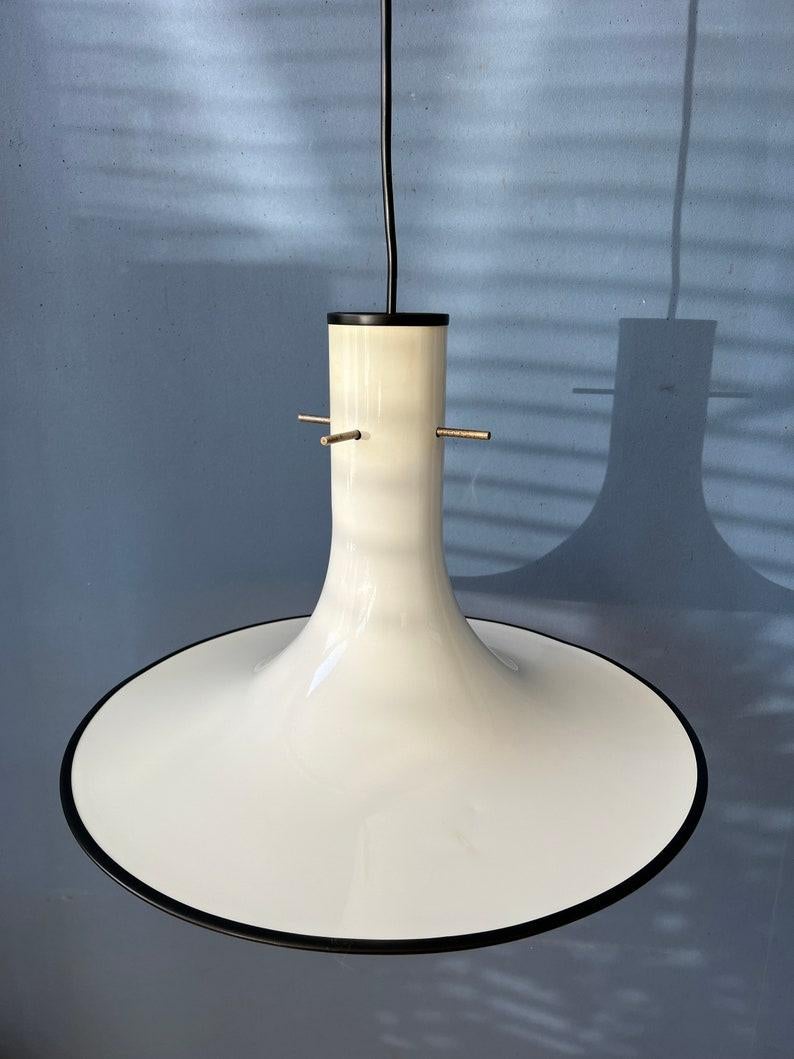 Very unique white witch hat pendant lamp with a black edge. The shade is made out of metal. The crossing of the metal pieces adds a nice decorative element. The lamp requires an E27 (E26) lightbulb.

Additional information:
Materials: