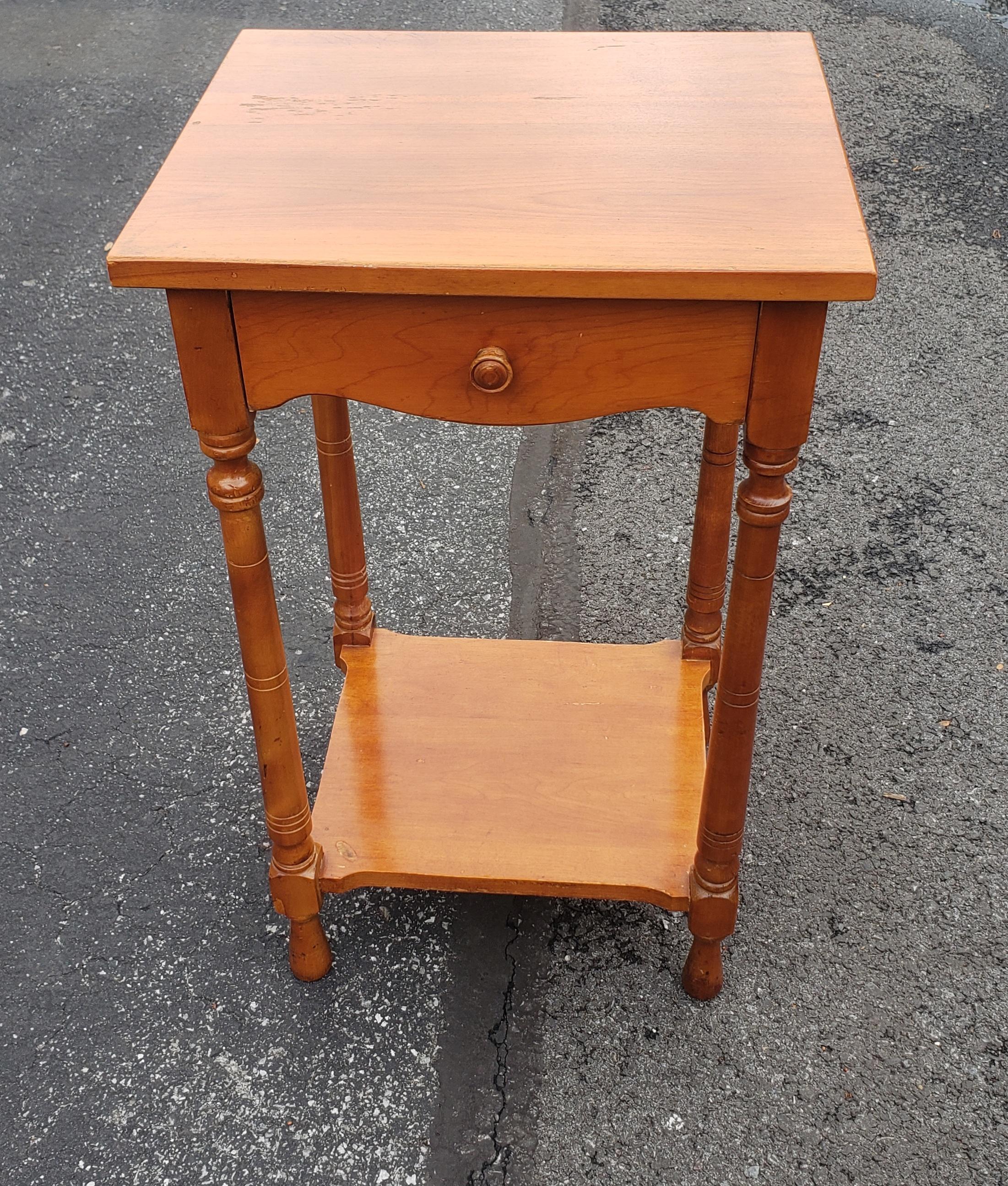 Mid-Century slender Whitney Furniture two tier Maple Single Drawer Side Table in good vintage condition.
Measures 16