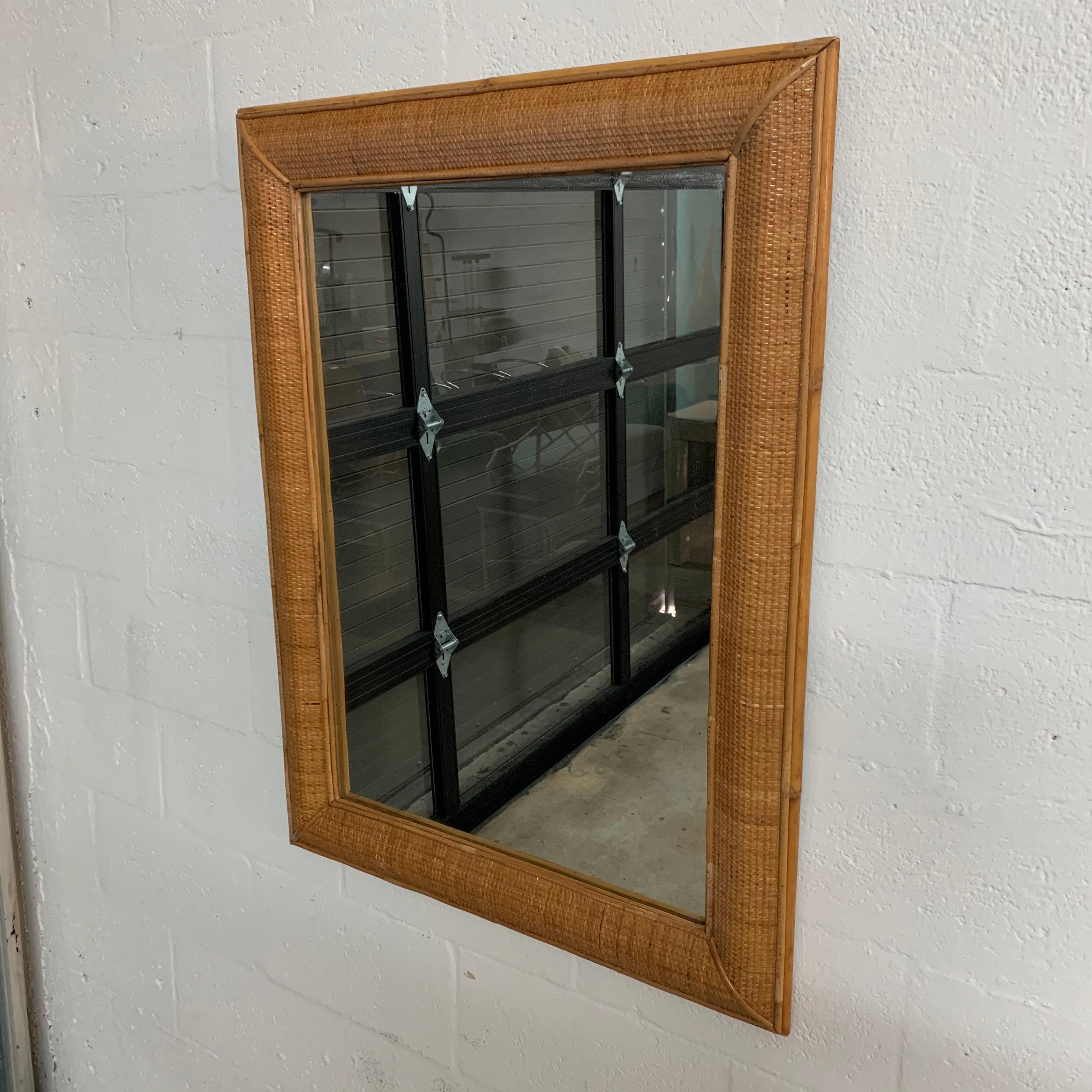 Classic rectangle mirror rendered in natural mixed-media of materials, woven wicker cane rattan reed bamboo by Walters Wicker Wonderland, New York, US, 1970s.