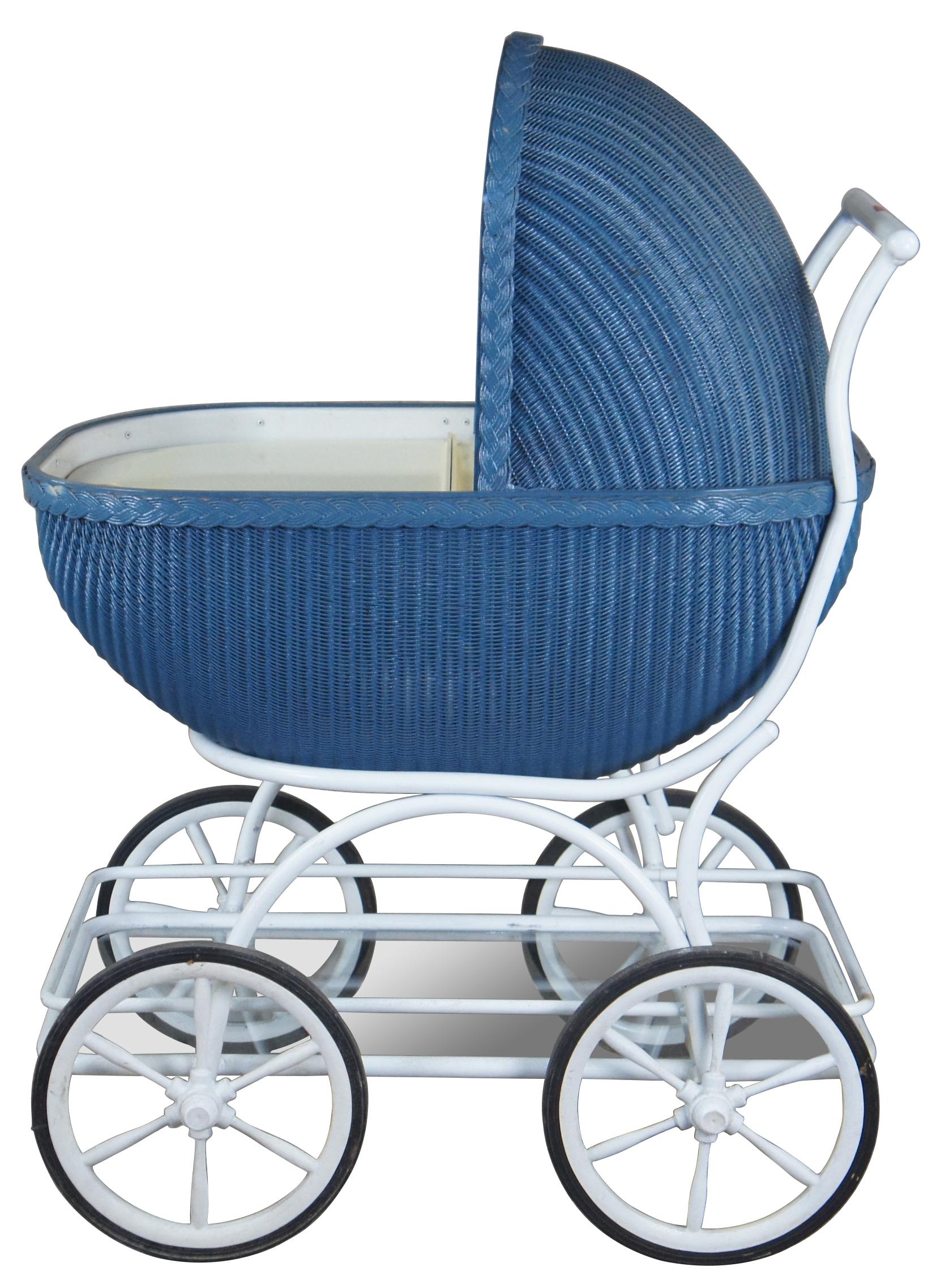 Mid century faux baby stroller beverage cooler or cart. Made of wicker with tubular metal frame featuring a top that flips to access both sides of cooler, plug to drain the melted ice, and a lower glass tier with gallery for supply storage.
 