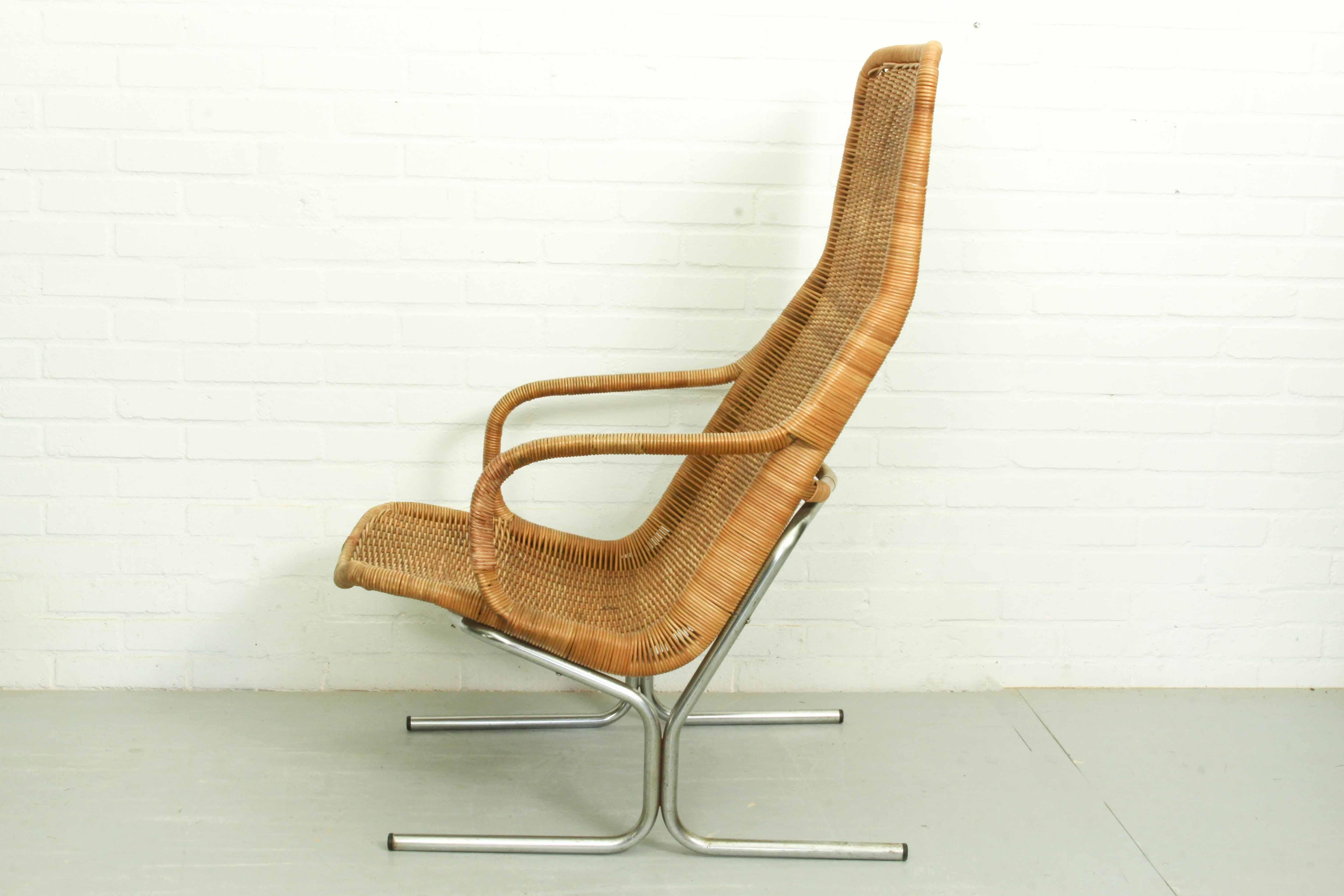 Armchair (model 514c) designed by Dirk van Sliedregt for Jonker Brothers, 1960 Netherlands. Chromed metal frame with rattan seat. Good vintage condition with some traces of use and old repairs in the rattan seat (see also photos).
