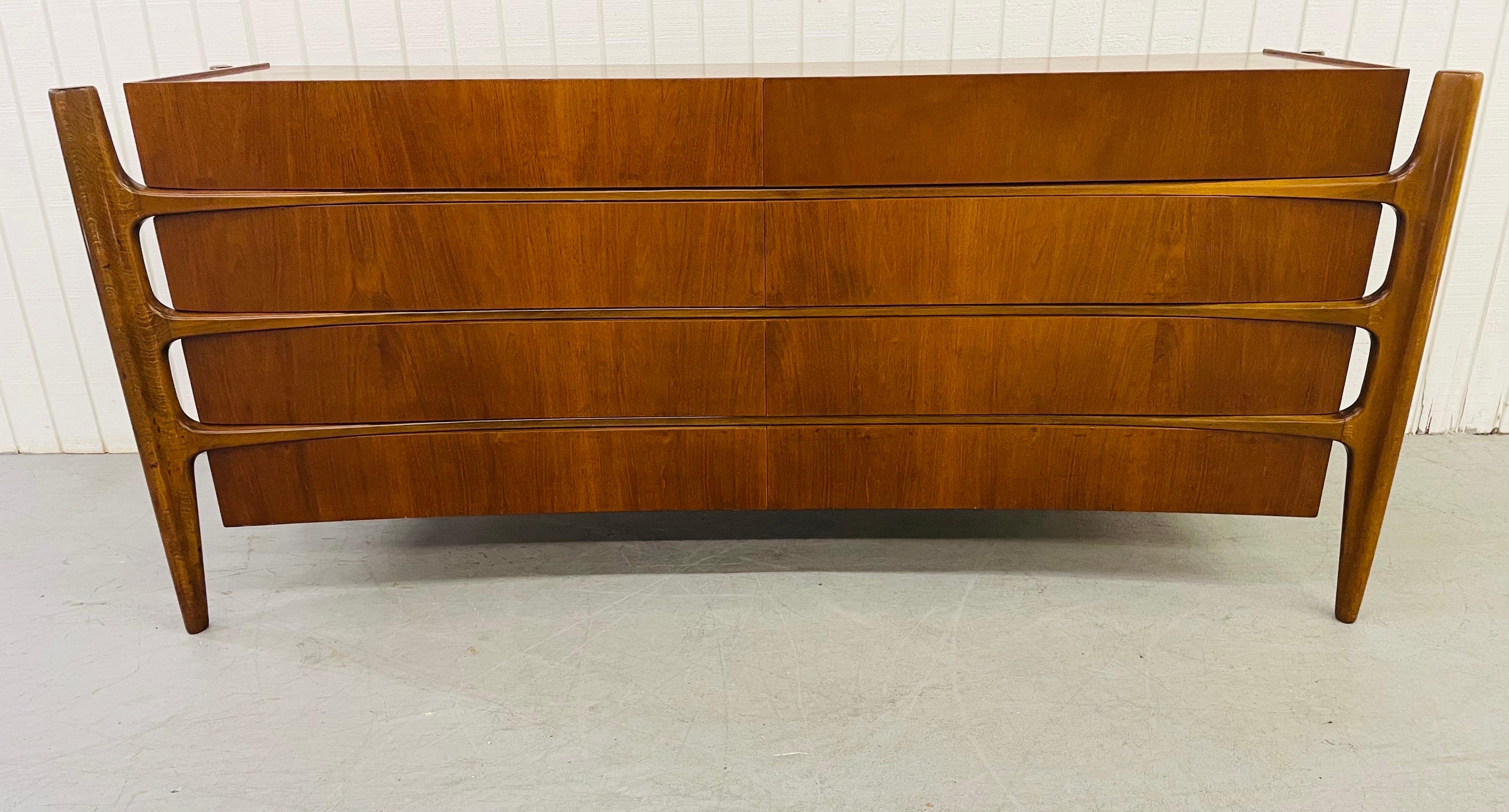 This listing is for a mid-century Scandinavian sculptural William Hinn Walnut Dresser. Featuring eight drawers for storage, a beautiful walnut finish, and an unbelievable design by William Hinn.