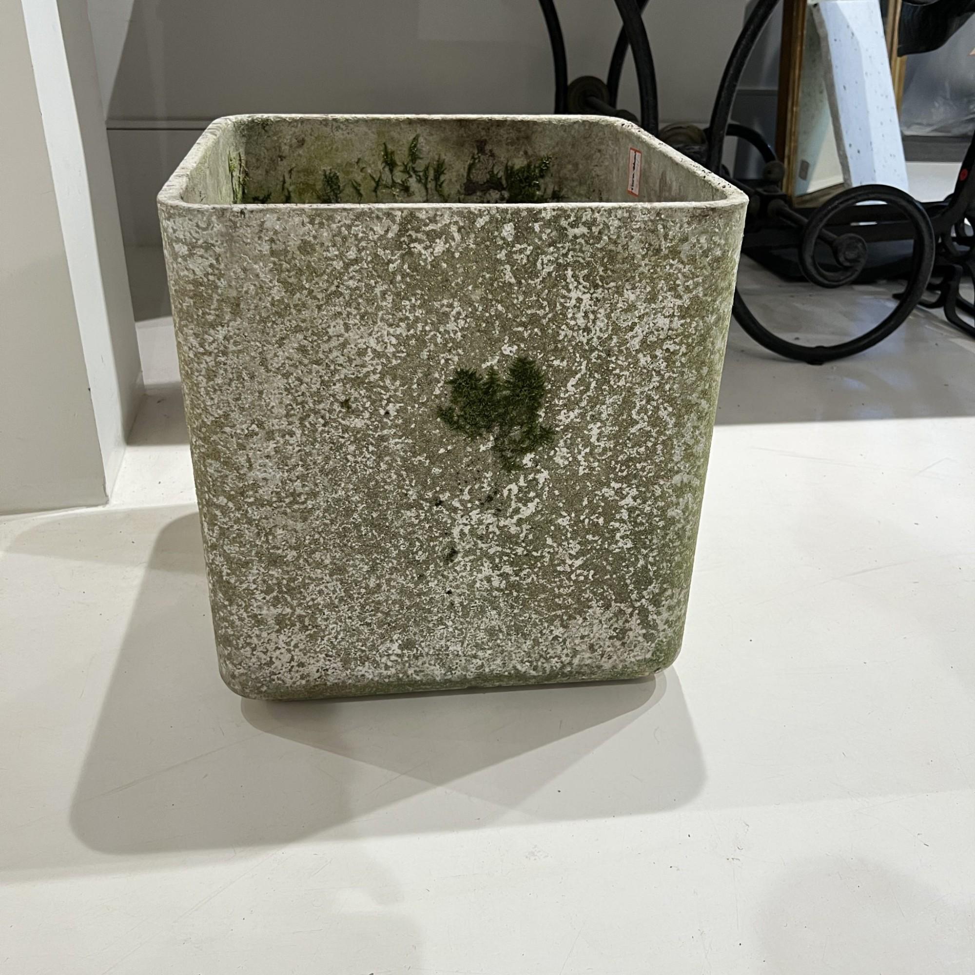 The mid-century Willy Guhl square jardiniere is a minimalist yet sculptural planter crafted from durable fiber cement, typically produced by Eternit in Switzerland. Known for its clean geometric lines and timeless appeal, this piece reflects Guhl’s