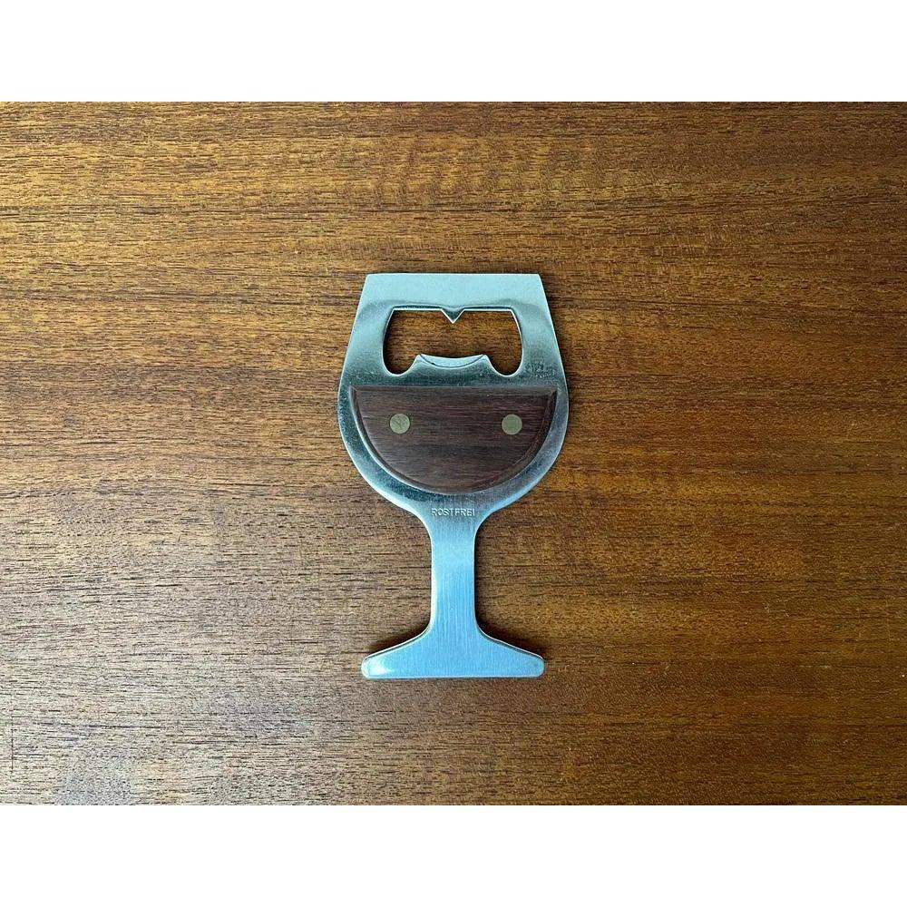 Mid-Century Wine Glass-Shaped Bottle Opener in Metal and Wood, 1960s, in Very Good conditions. Designed 1960 to 1969

Additional information:
Materials: Metal, Wood
Color: Brown
Styles: Mid-Century Modern
Item Type: Vintage, Antique or