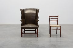 Mid-century Wing Back Armchair in green leather, UK