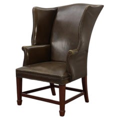 Mid-century Wing Back Armchair in green leather, UK