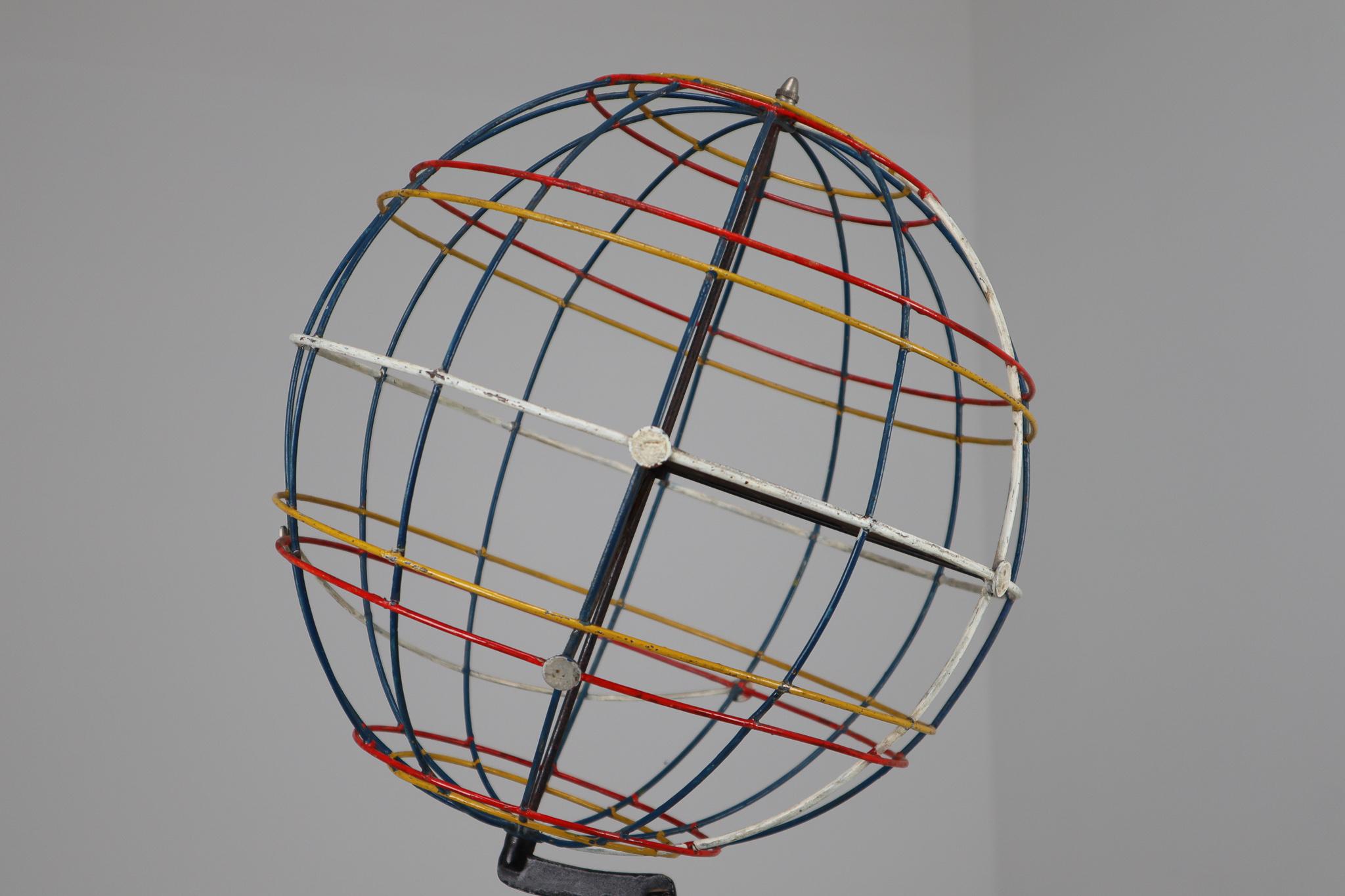 Mid-century decorative globe model from Germany from the 1950s. Made for educational reasons, used for classroom demonstration and study. In good condition with signs of age and patina.