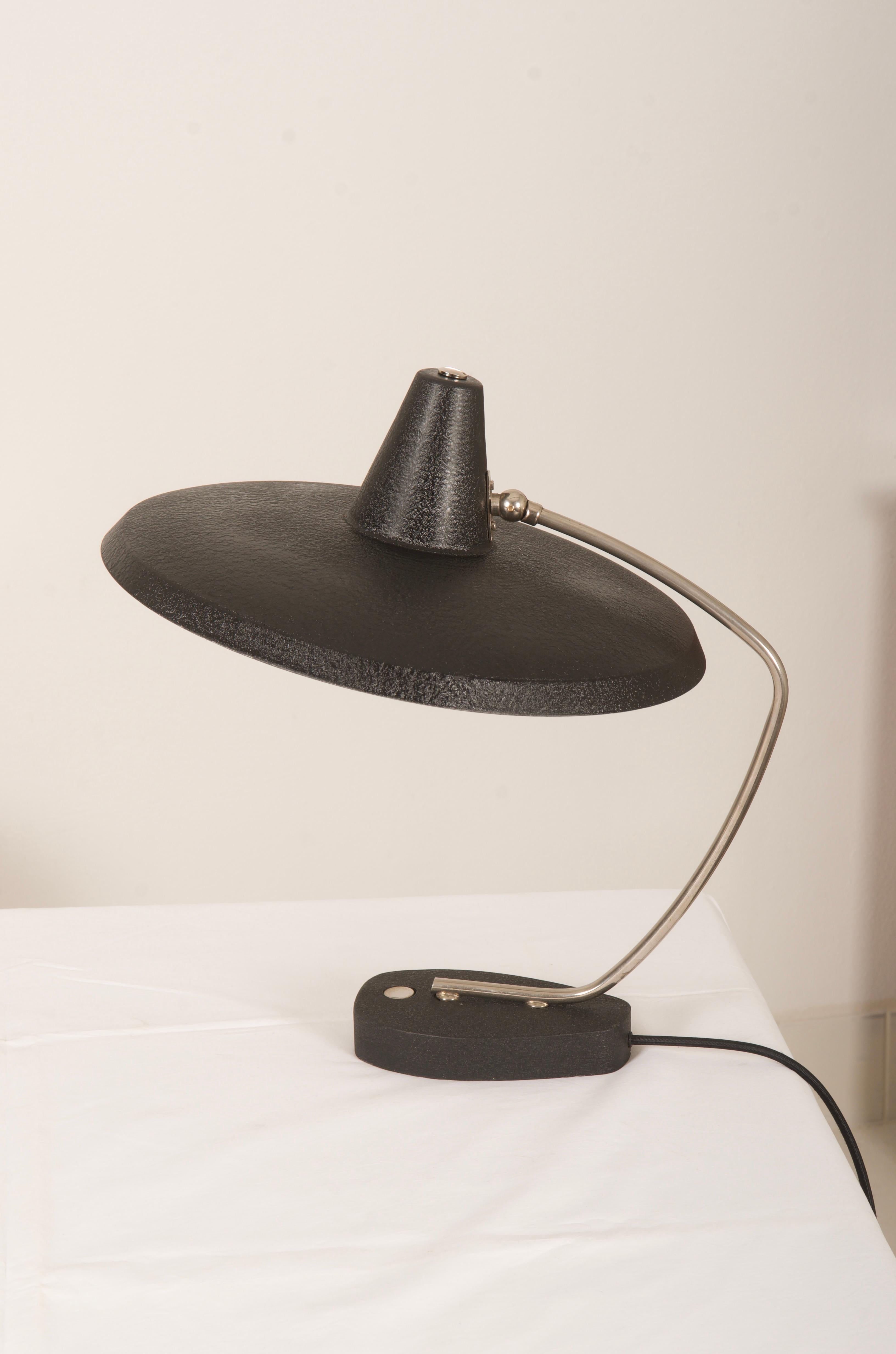 Brass / steel construction with a witch hat shaped lampshade black painted fitted with one E27 socket, model. Attribute to Christian Dell.
Beautiful original condition.
   