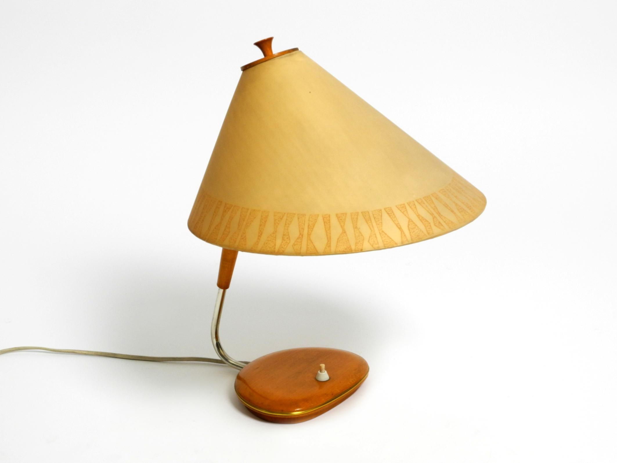 Beautiful, rare, large Mid Century wood table lamp with fabric shade from the former DDR (GDR, East Germany).
With manufacturer's stamp and exact production date February the 18th, 1966.
VEB Halle Saale, an electric lighting fixture factory.
Great