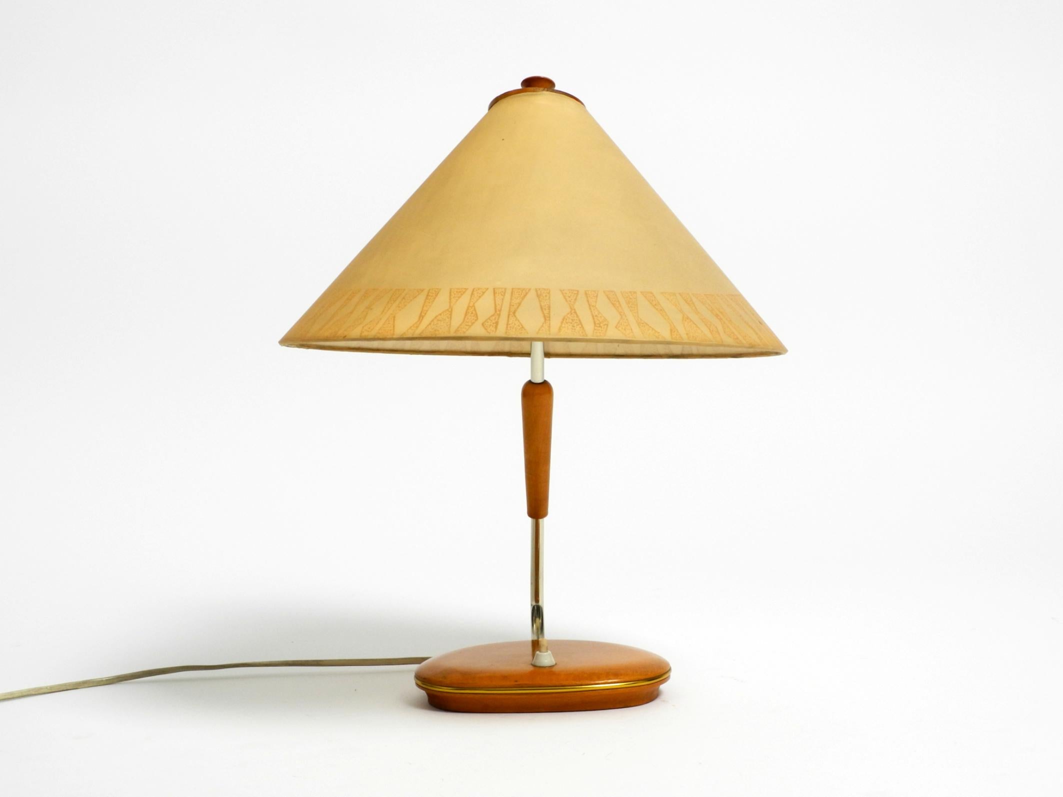 German Mid Century wood and fabric shade table lamp from the DDR with stamp from 1966