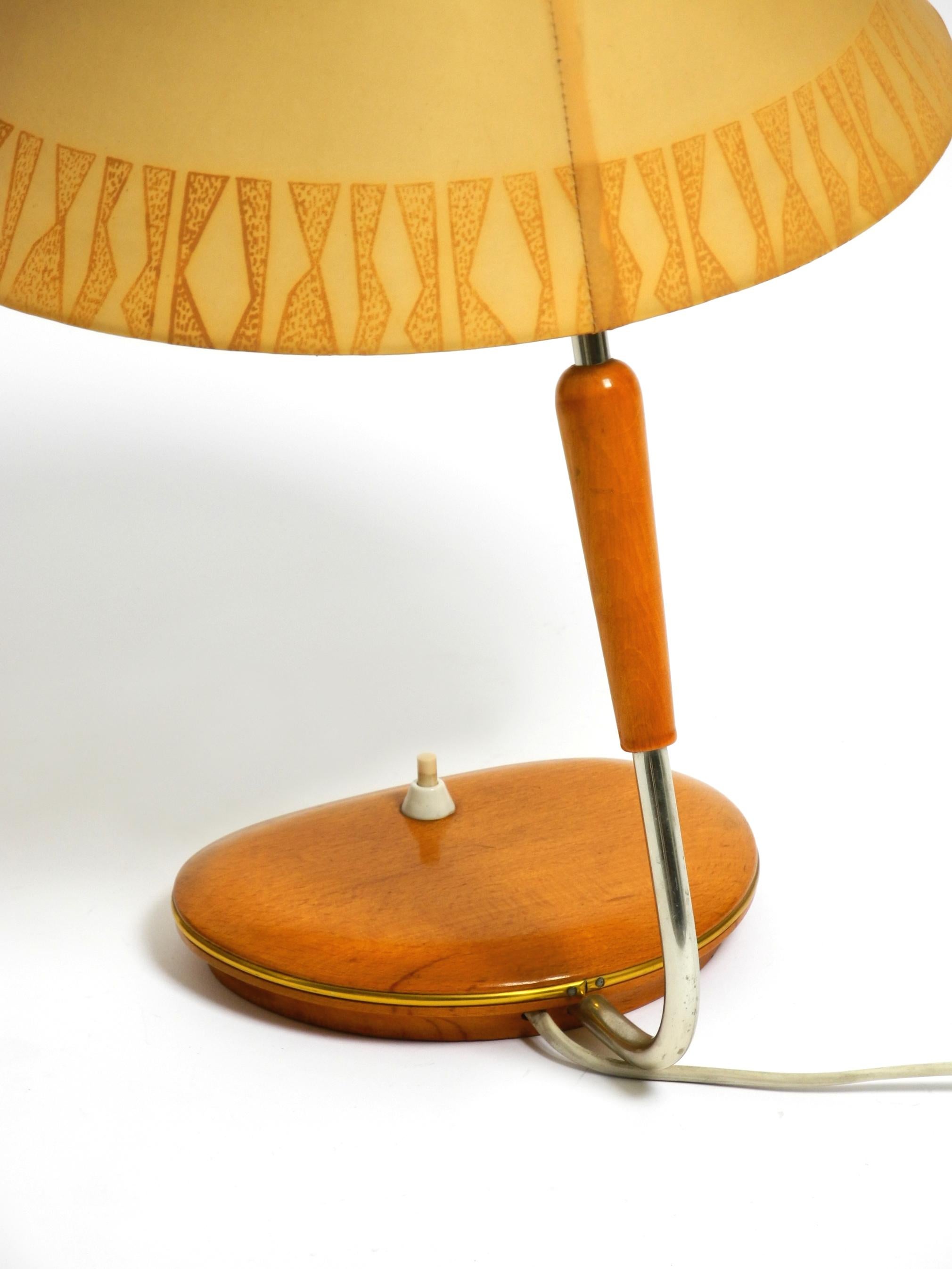 Mid Century wood and fabric shade table lamp from the DDR with stamp from 1966 2