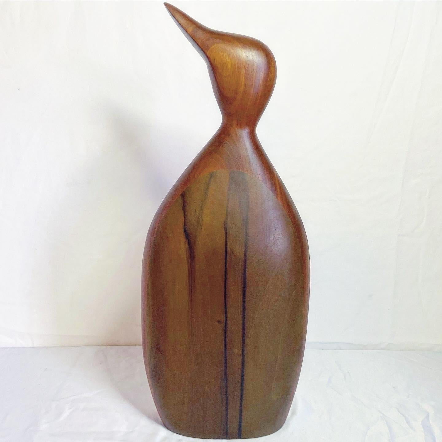 Paul LaMontagne is an American, 20th/21st Century Artist. This is a large carved wood sculpture depicting a standing bird. The base is signed on the underside Paul LaMontagne 1987.

Additional information:
Material: Wood
Color: Brown
Style: