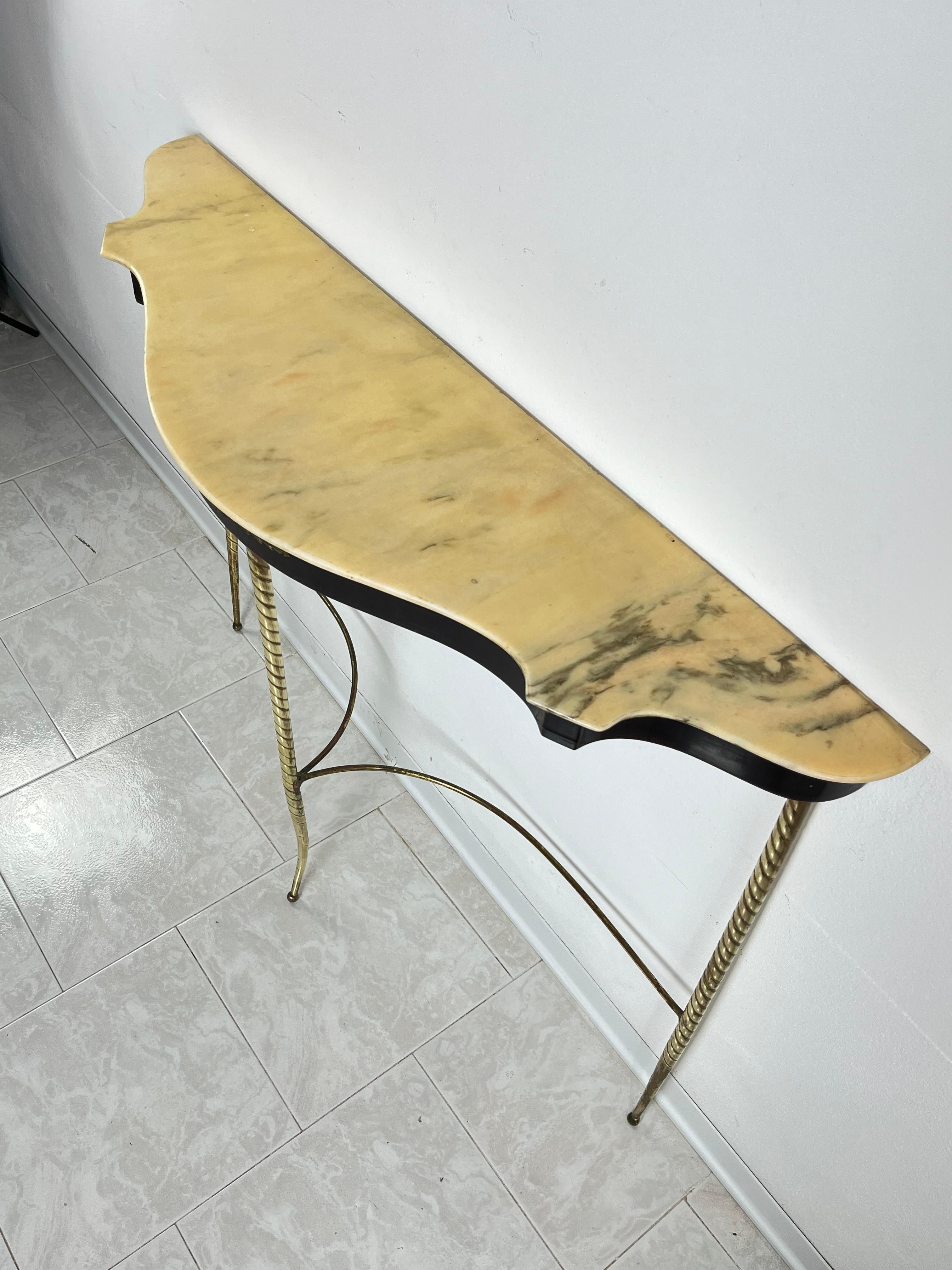 Mid-Century wood, brass and marble top console attributed to Paolo Buffa 1950s
Intact and in good condition, small signs of aging.

We guarantee adequate packaging and will ship via DHL, insuring the contents against any breakage or loss of the