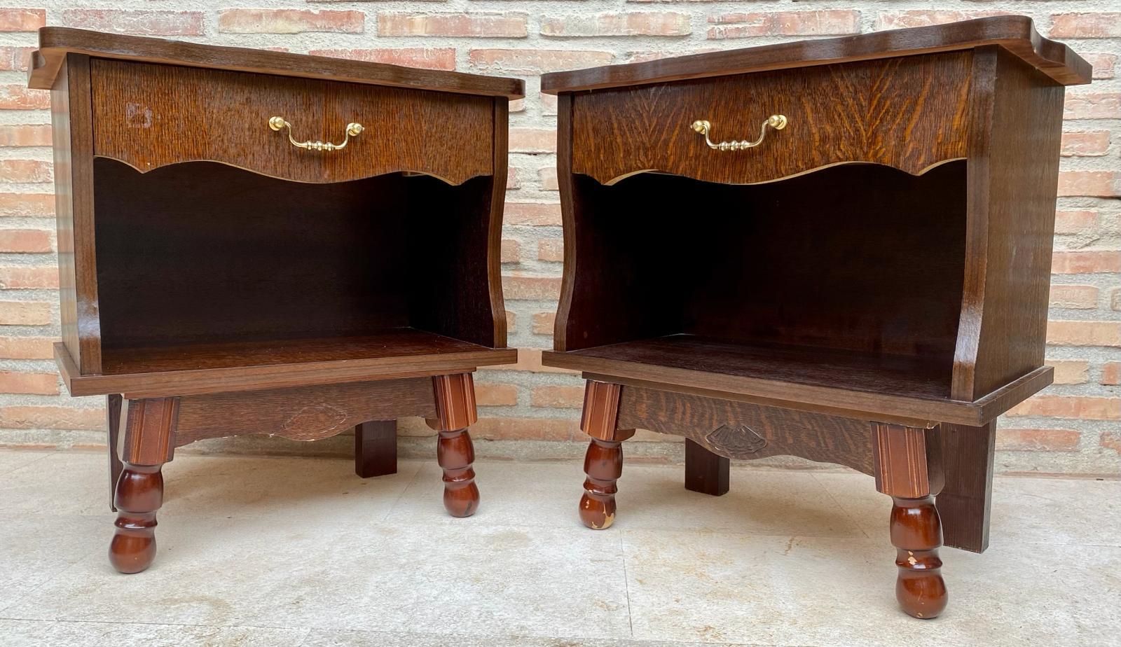 Circa 1960's Pair of Nightstands, Mid-Century Vintage Retro Nightstands.
solid wood legs
Original fittings made of brass.
A drawer with its brass handle and a low open shelf.
Interesting design of four different legs from each other.
Timelessly