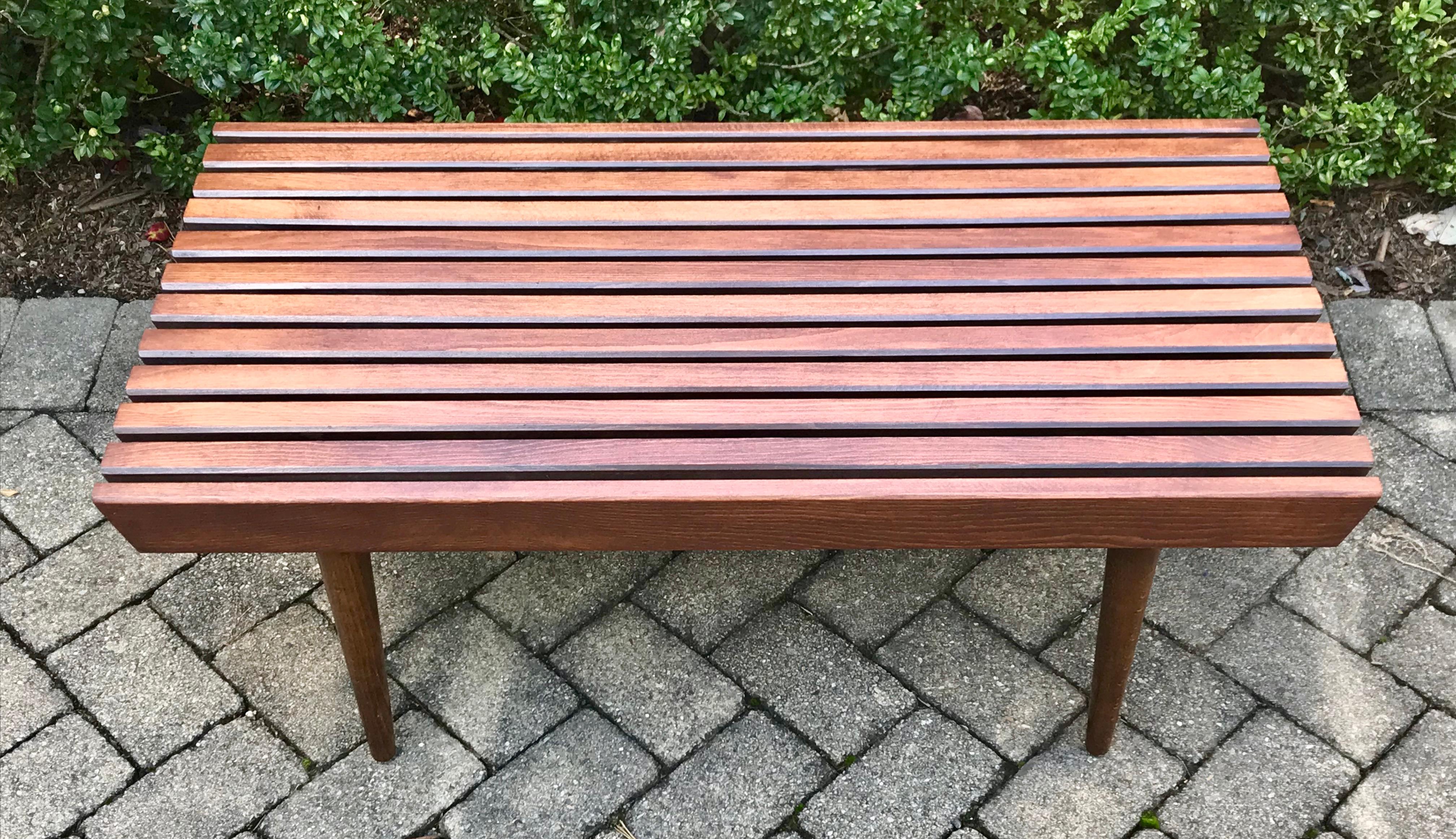 Very sharp slat bench in the style of George Nelson. Very functional as a coffee table or side table. Professionally restored.