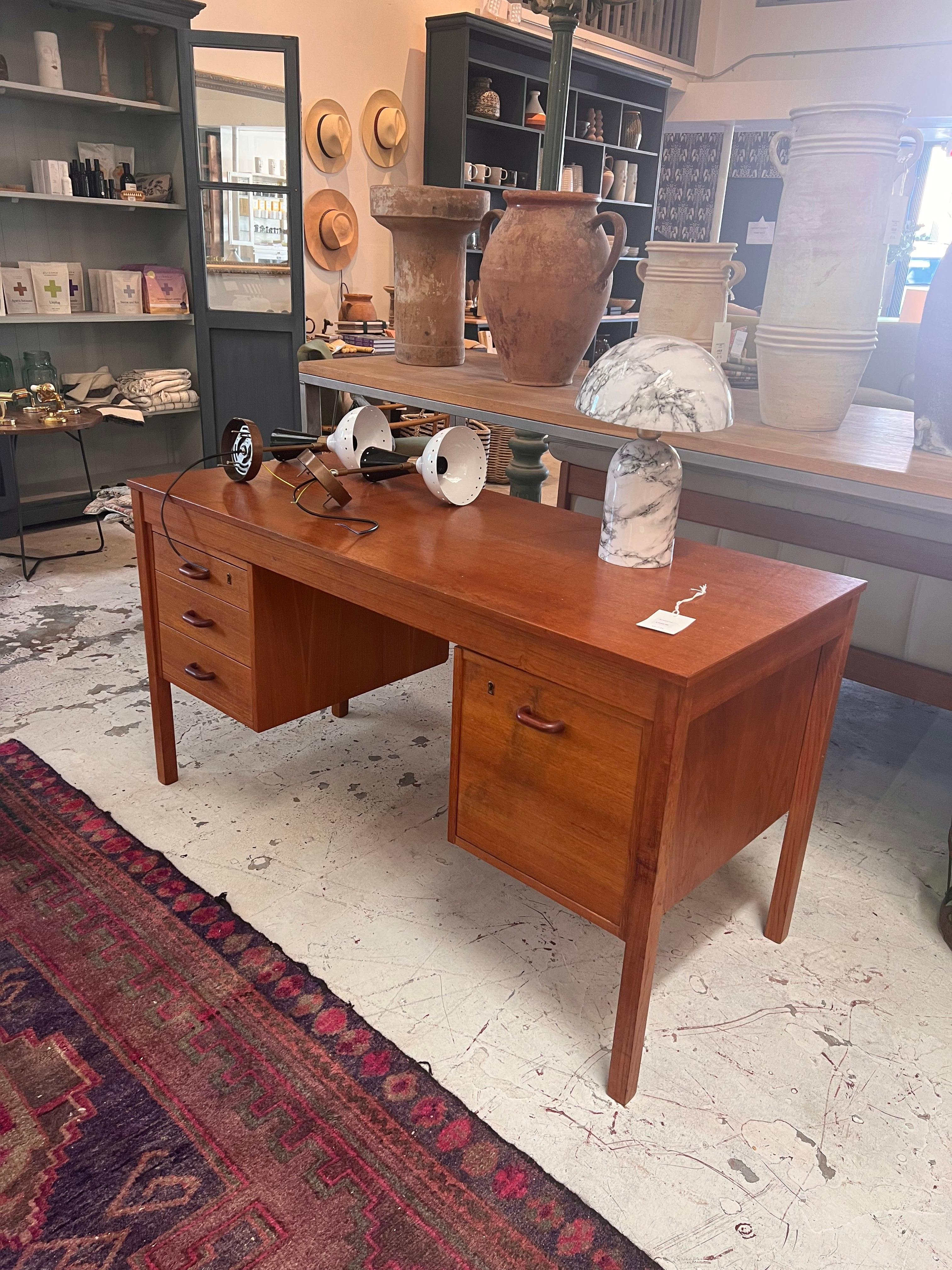 This authentic midcentury desk is perfect for any work space in the home. 

Dimensions: 50