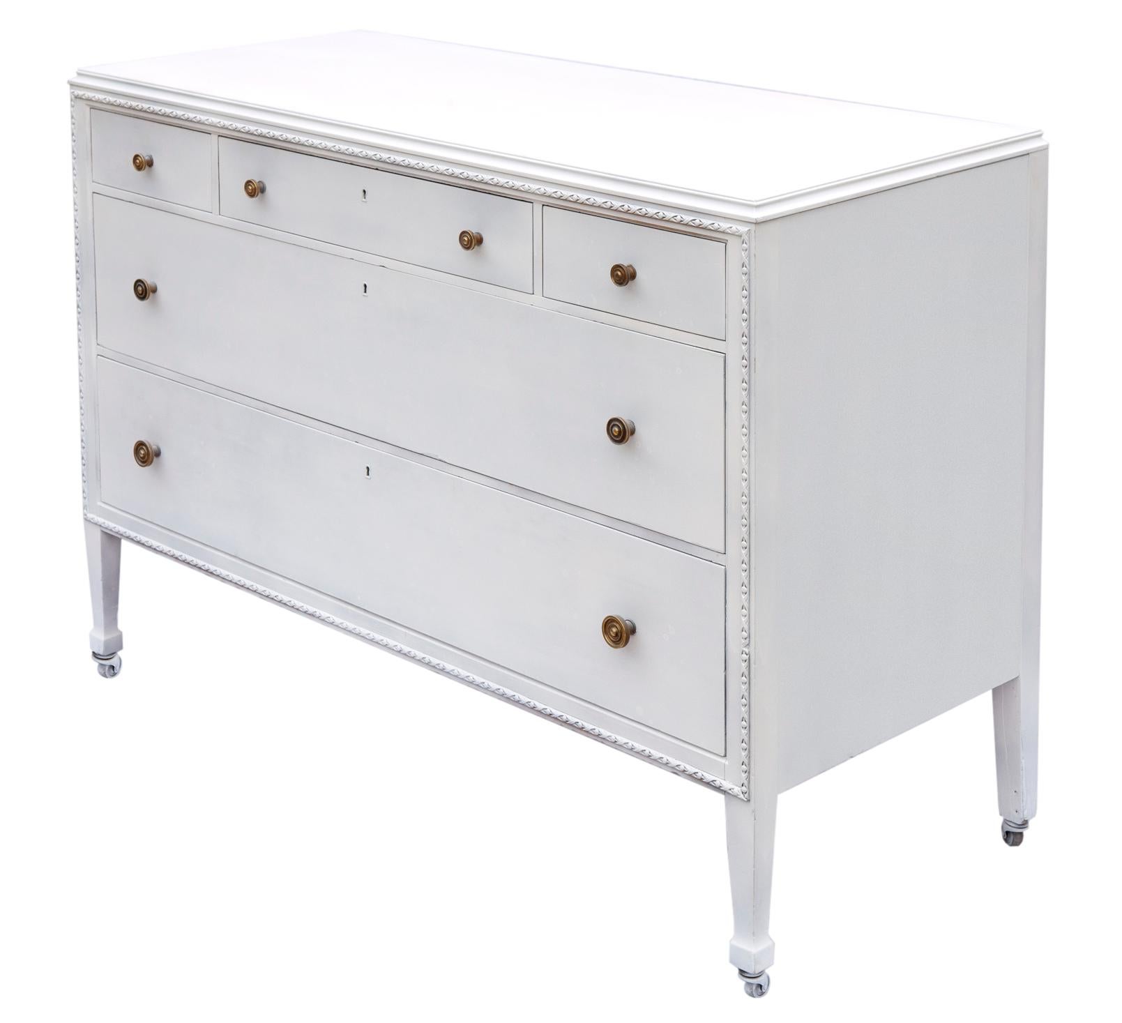 Early Mid-Century Dresser by Woodard Furniture Company.
A stunning white dresser with eye catching carving surrounding the drawers in a lusturous satin finish. The front embellished with carved trim surrounding the drawers.
There are two spacious