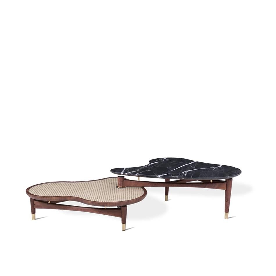 This stunning center table brings us the best of both worlds, a
touch of nature with a rattan lower half, and a modern touch with
black marble on the upper half. With a mid-century style and
space age aesthetic, this center table vows to elevate