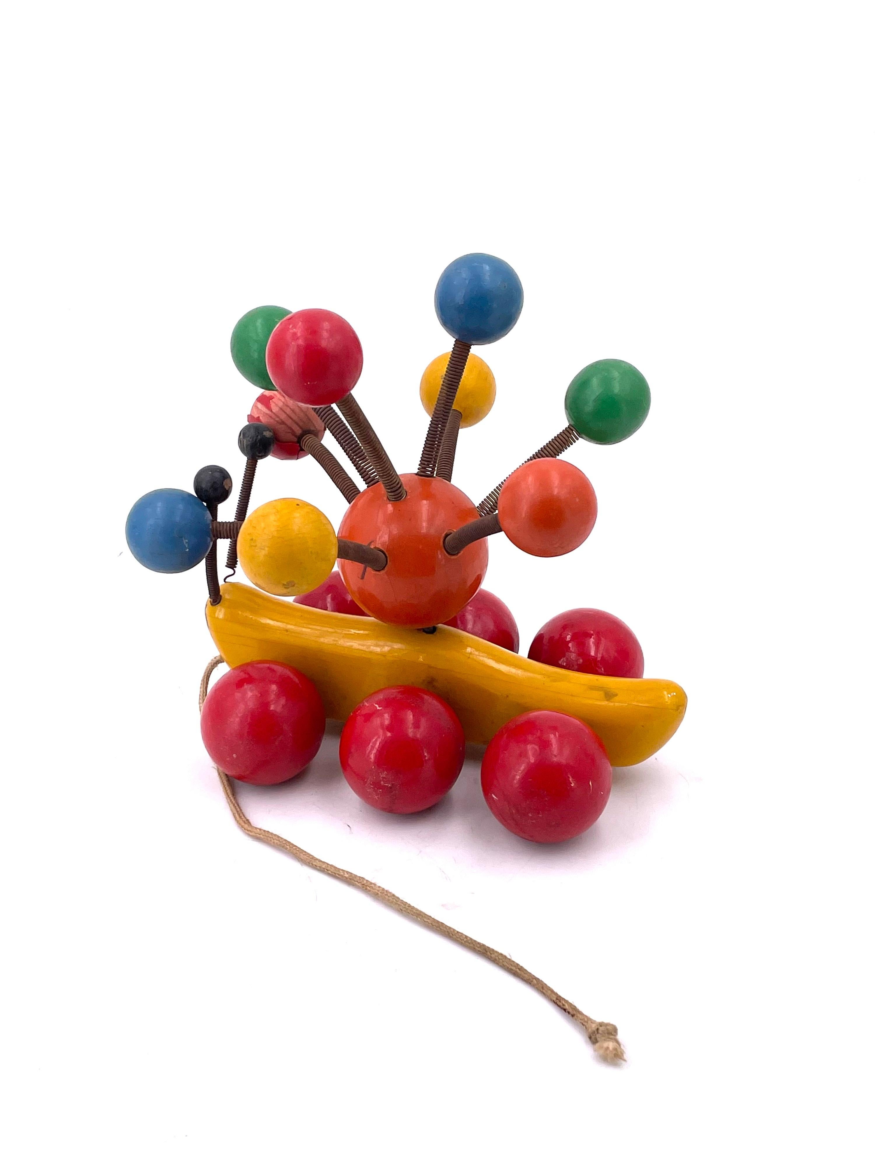 Beautiful unique caterpillar toy solid lacquer painted wood in colorful colors, circa 1950;s Made in Greece by Kouvalias.