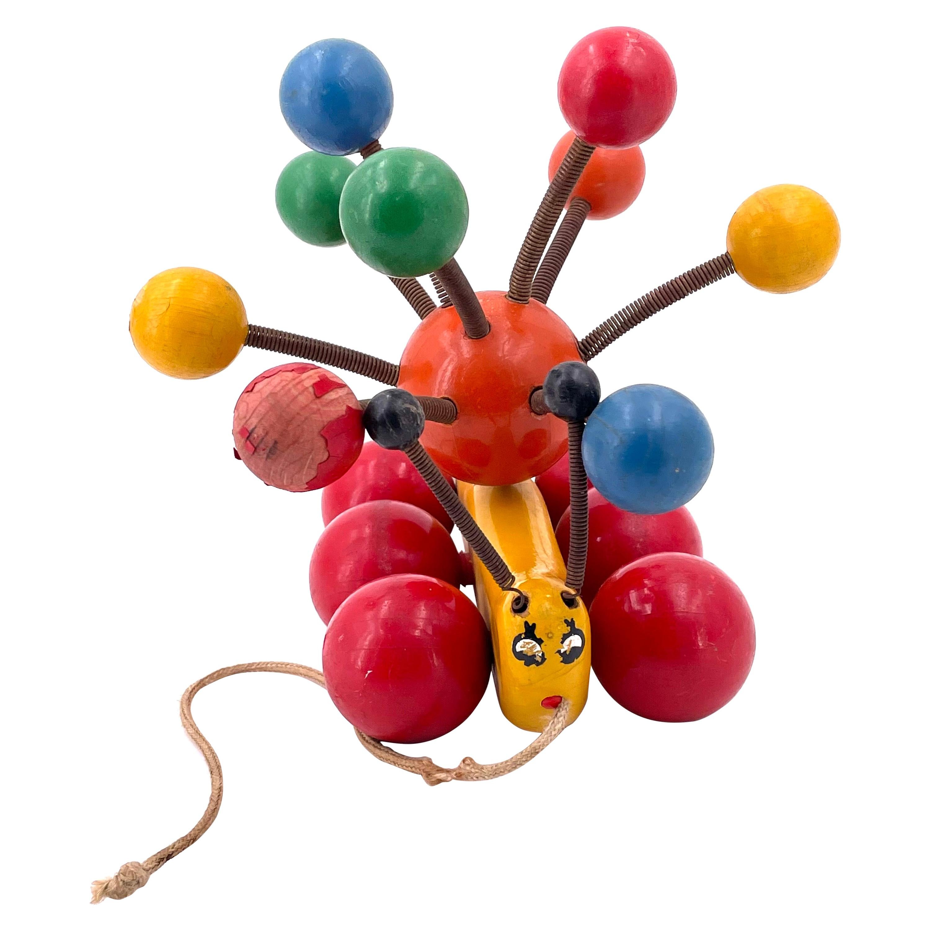Mid Century Wooden Lacquer Pull Toy Caterpillar Banana Slug and Colorful Balls For Sale
