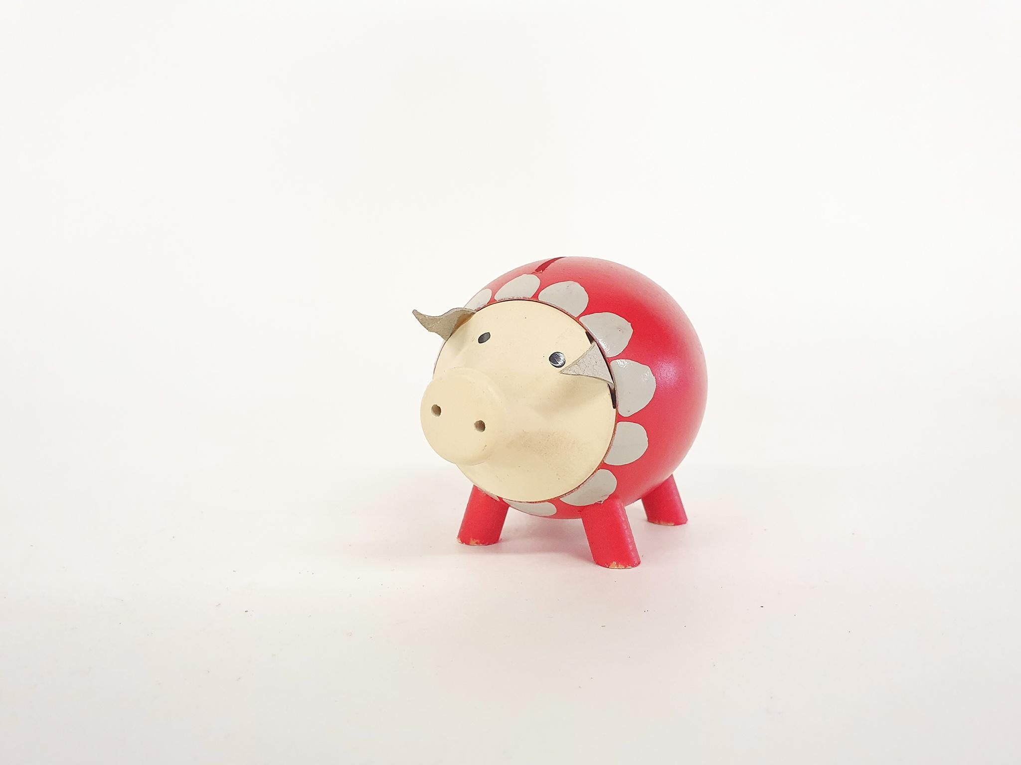 Handpainted wooden piggy bank. The head can come off to take out your savings.