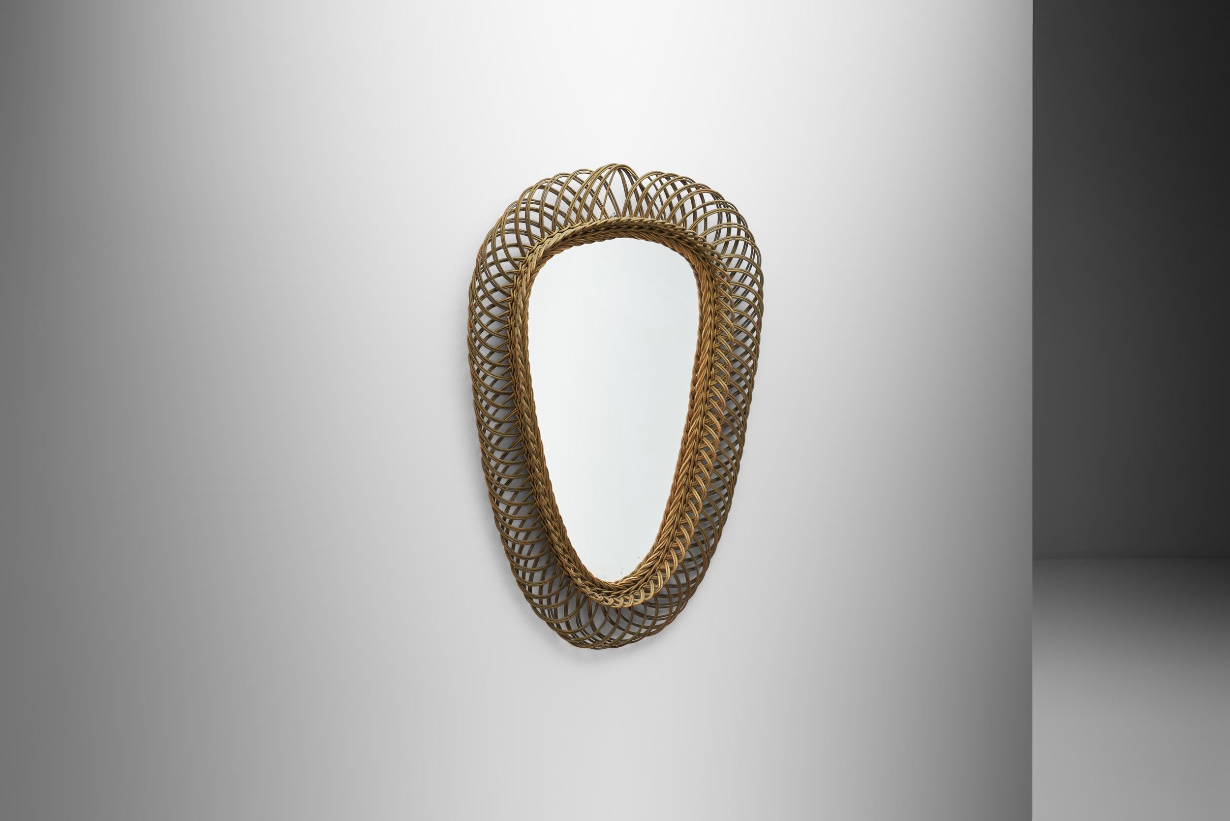 Fusing function and form, accent mirrors offer useful reflection while also providing an eye-catching focal point in any room. This beautiful decorative mirror in the manner of famed Italian designer, Franco Albini, has a light, yet defined look