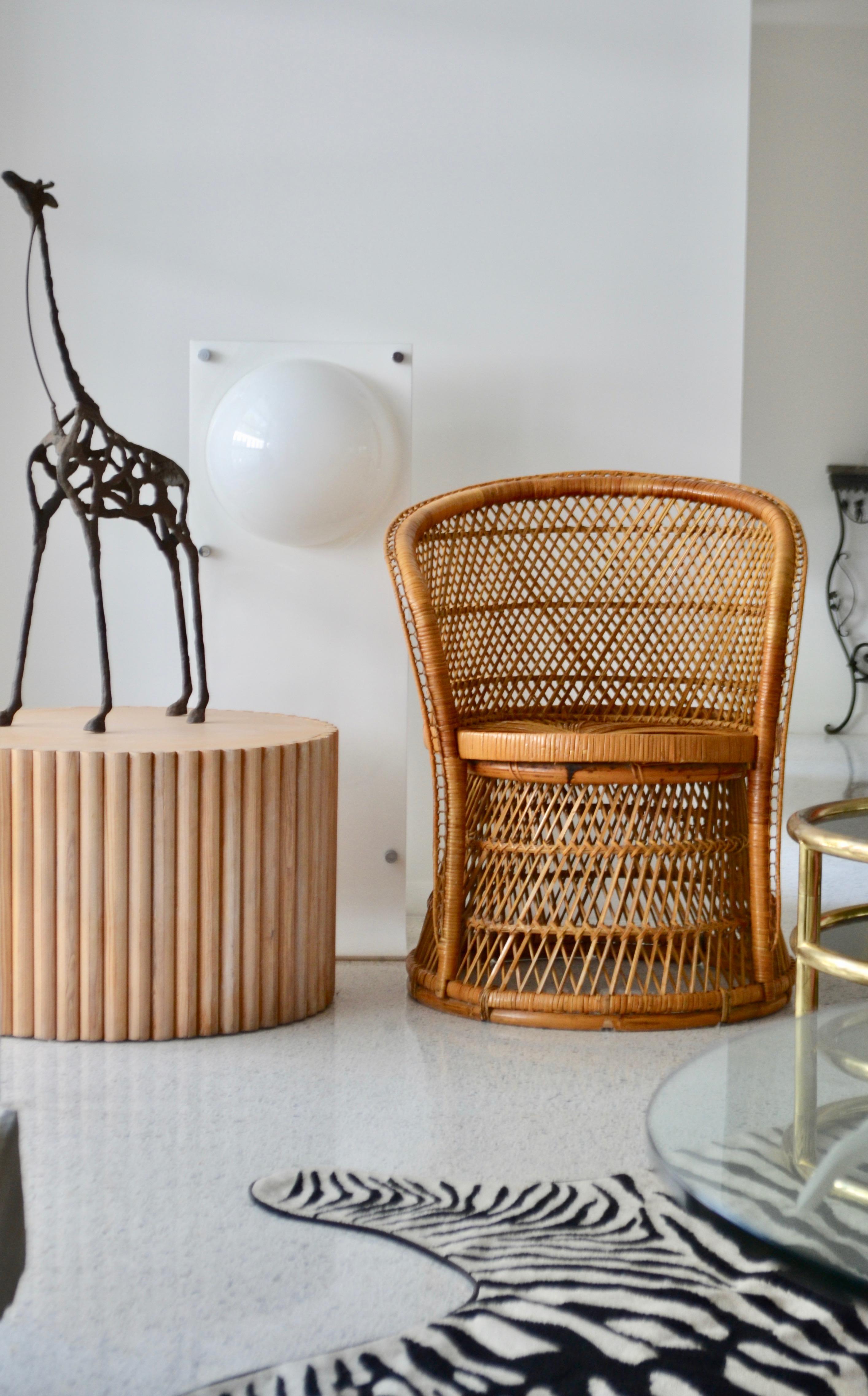 Striking midcentury woven rattan tub chair, circa 1960s. This sculptural occasional chair or side chair is designed with intricately webbed rattan and open weave seat and back.
