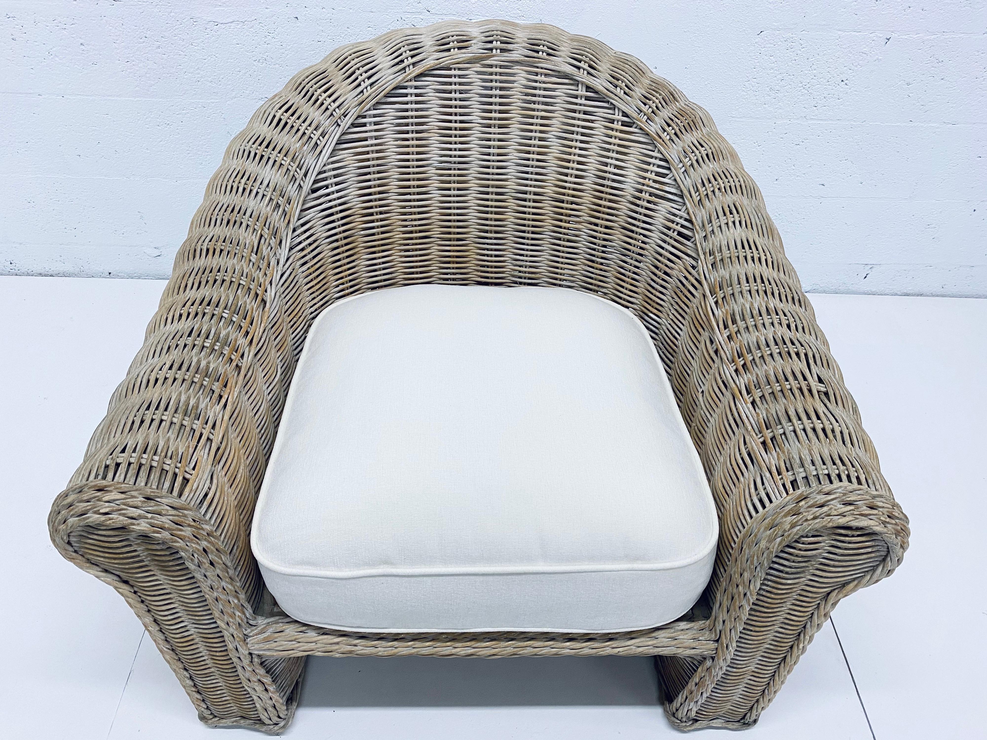 1970s woven whitewashed reeded lounge chair with newly upholstered high quality white cotton linen indoor cushion. The seat supports have also been redone to provide many more years of use. High quality and very comfortable lounge chair.