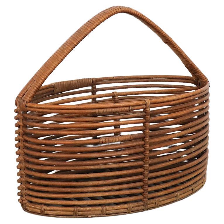 Mid-Century Woven Willow Basket or Magazine Rack For Sale
